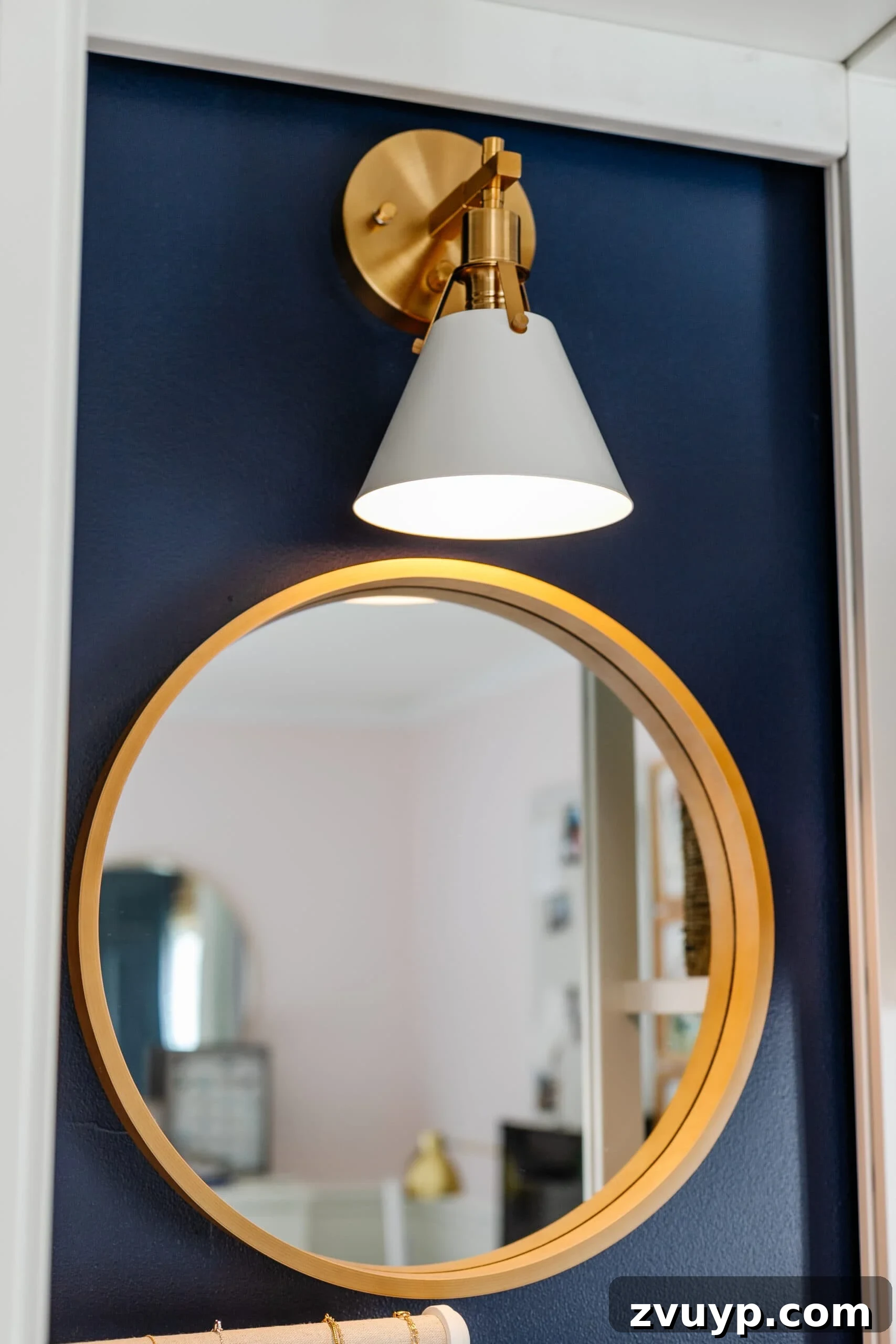 Girl's Guide to a Tidy Tiny Closet: 10 Smart Ideas 8 closet lighting using a sconce with battery puck light over a mirror