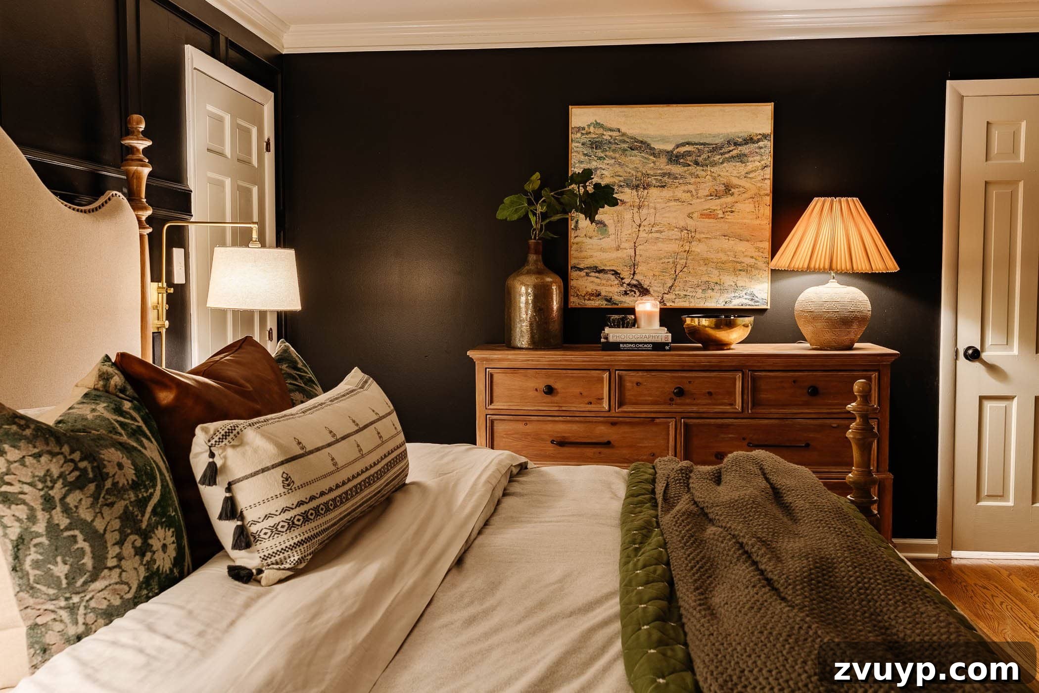 Winter Warm-Up: Easy Decor for a Cozy Retreat 4 Cozy winter bedroom decor featuring green bedding, a warm lamp on a dresser, and minimalist styling