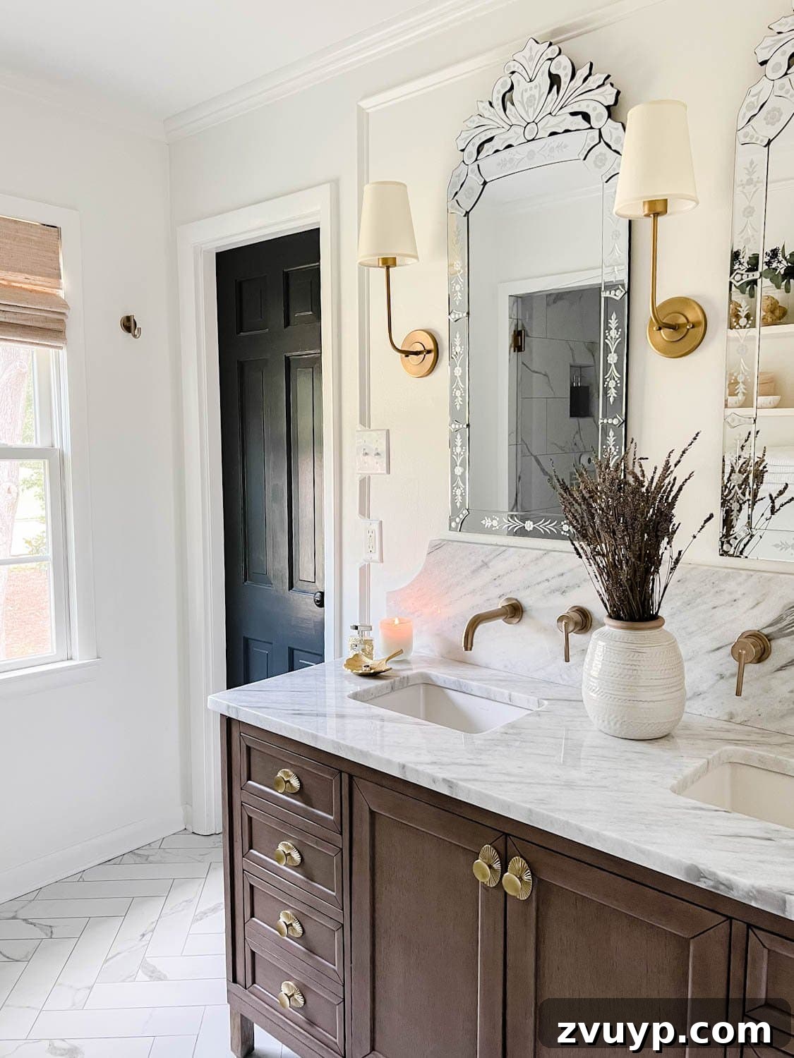 Parisian Chic on a Shoestring Budget 3 A chic Parisian-inspired bathroom featuring crisp white walls, a striking black door, a warm wood vanity, and a luxurious marble countertop, embodying elegant simplicity.