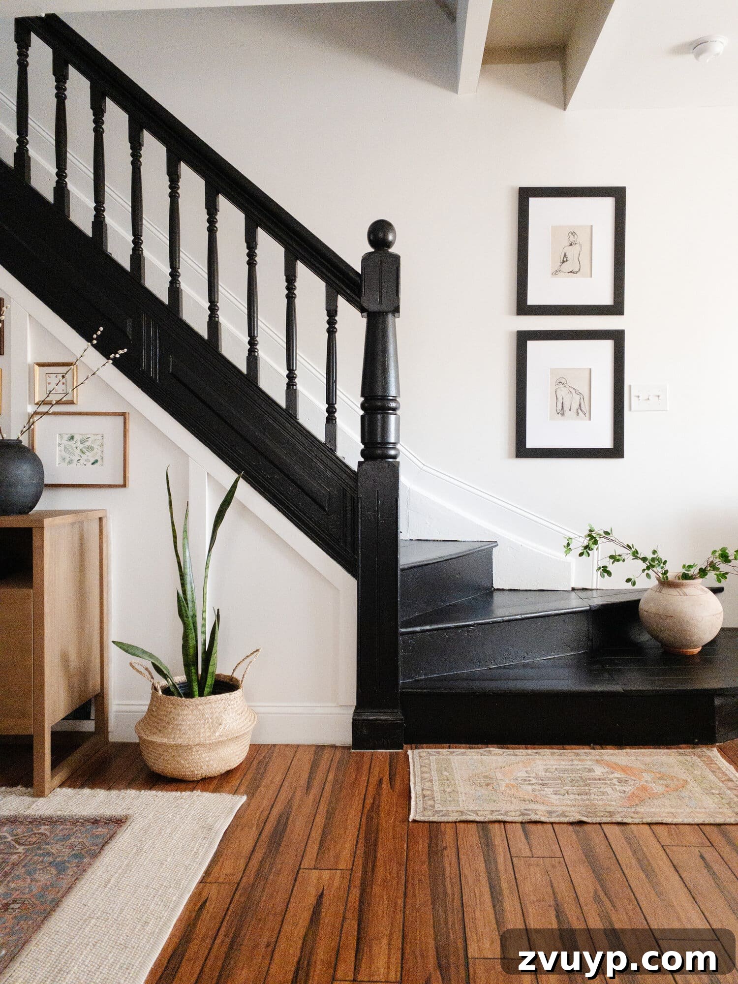 Elevate Your Foyer: 9 Dramatic Black Stair Railing Designs 12 plain painted black stairs