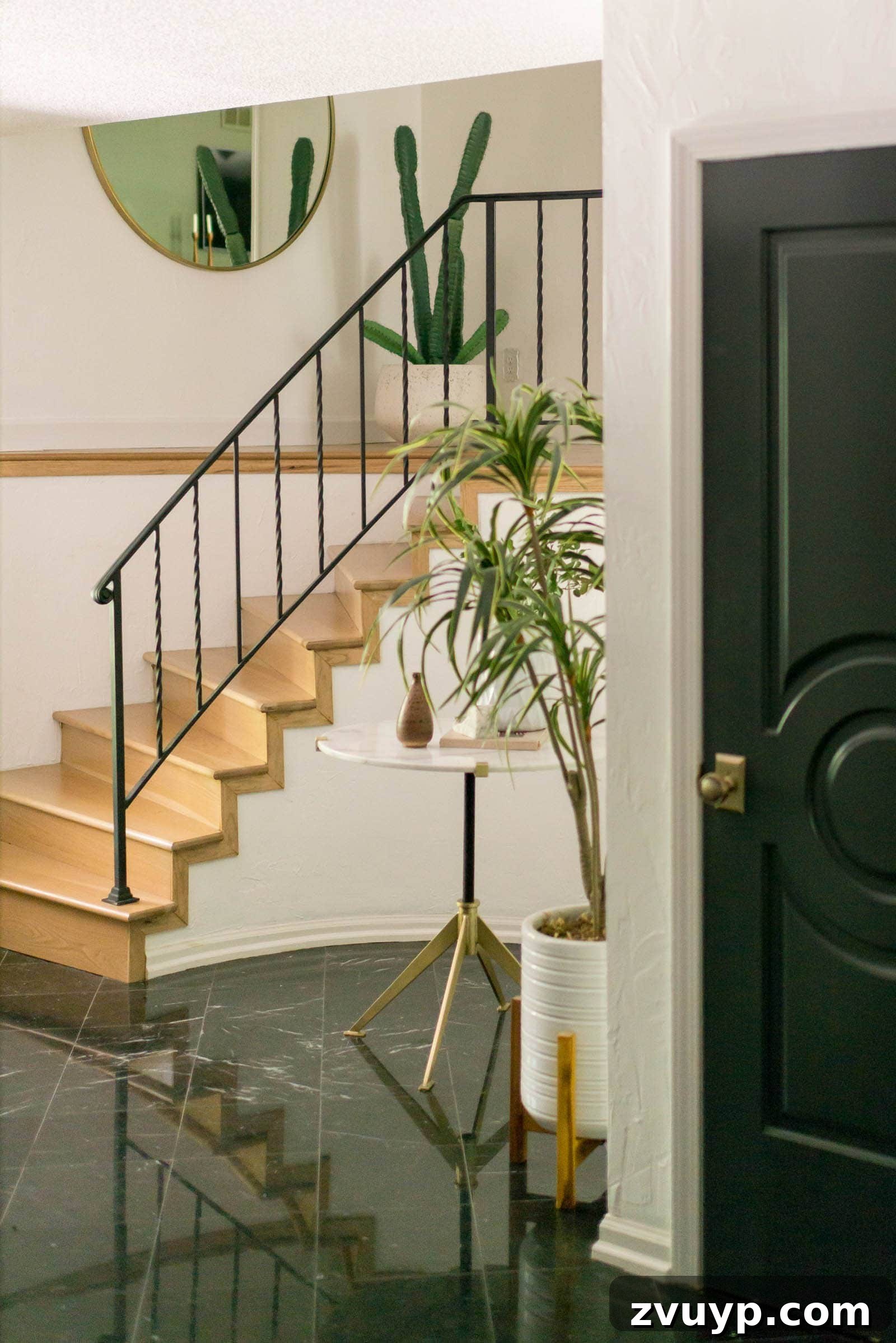 Elevate Your Foyer: 9 Dramatic Black Stair Railing Designs 13 minimalist wrought iron black staircase