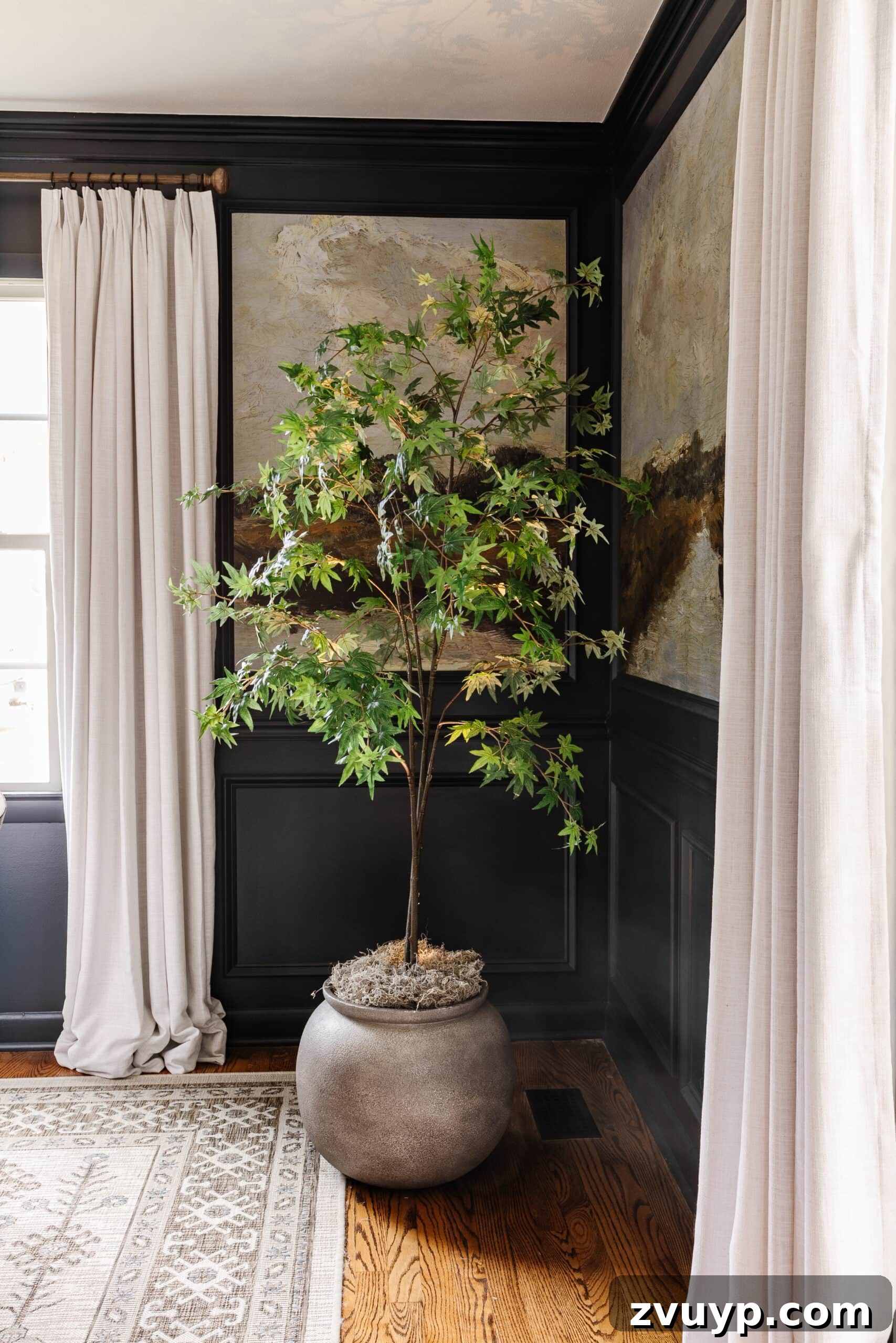 Realistic Artificial Trees: Expert Tricks for Indoor Authenticity 10 faux indoor tree in large planter with moss and uplight