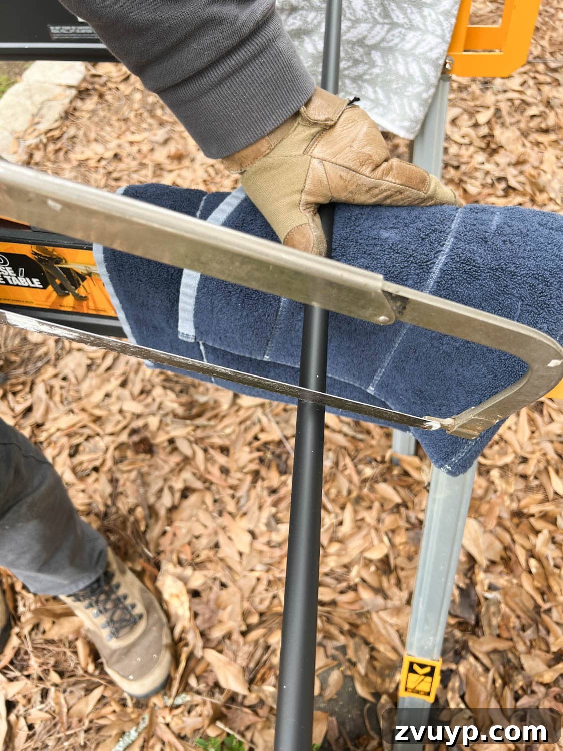 DIY Stair Spindle Swap For A Modern Makeover 14 Cutting new stair balusters with a hack saw, emphasizing care and precision