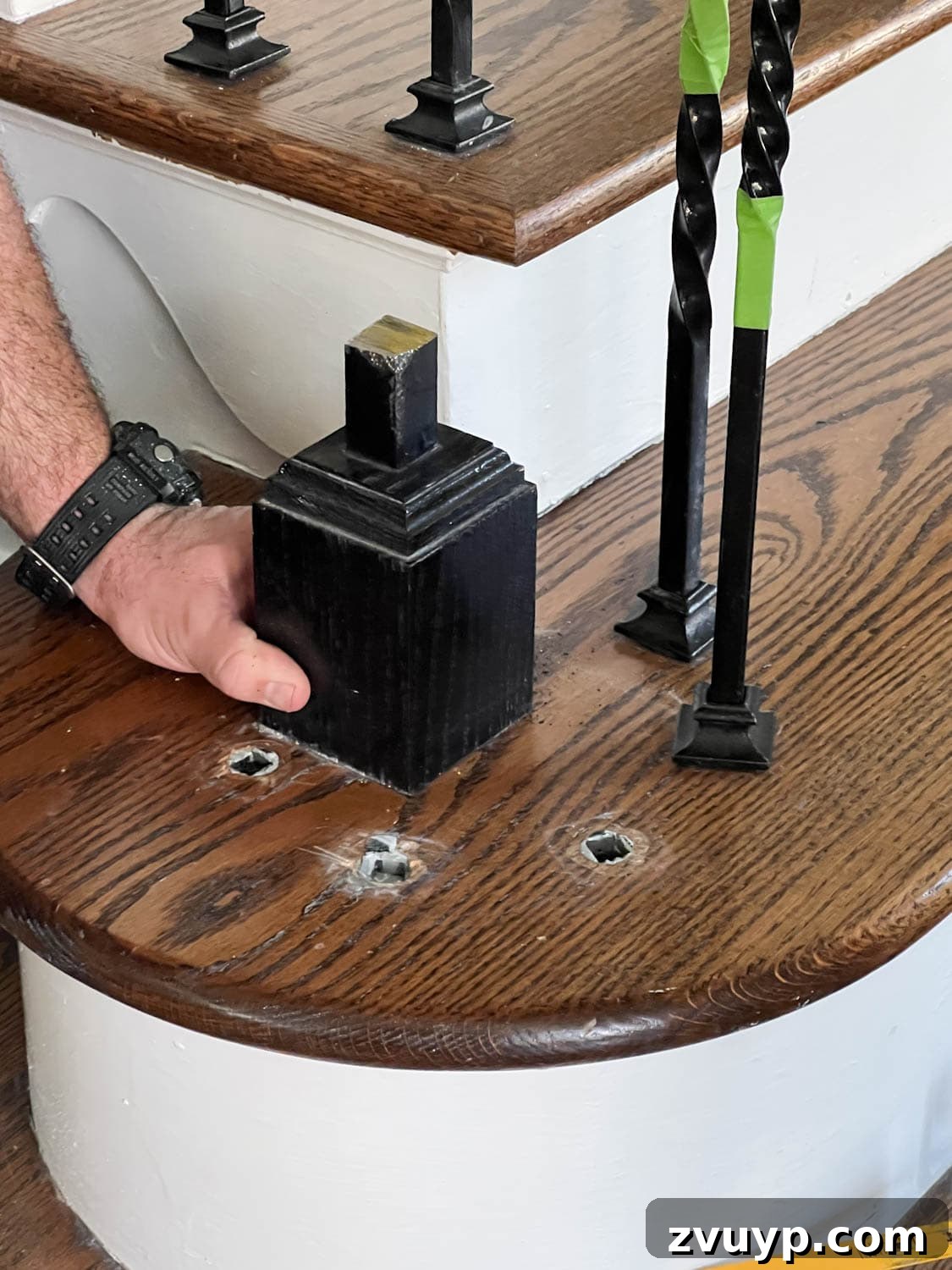 DIY Stair Spindle Swap For A Modern Makeover 16 Process of removing an old newel post from a stair railing
