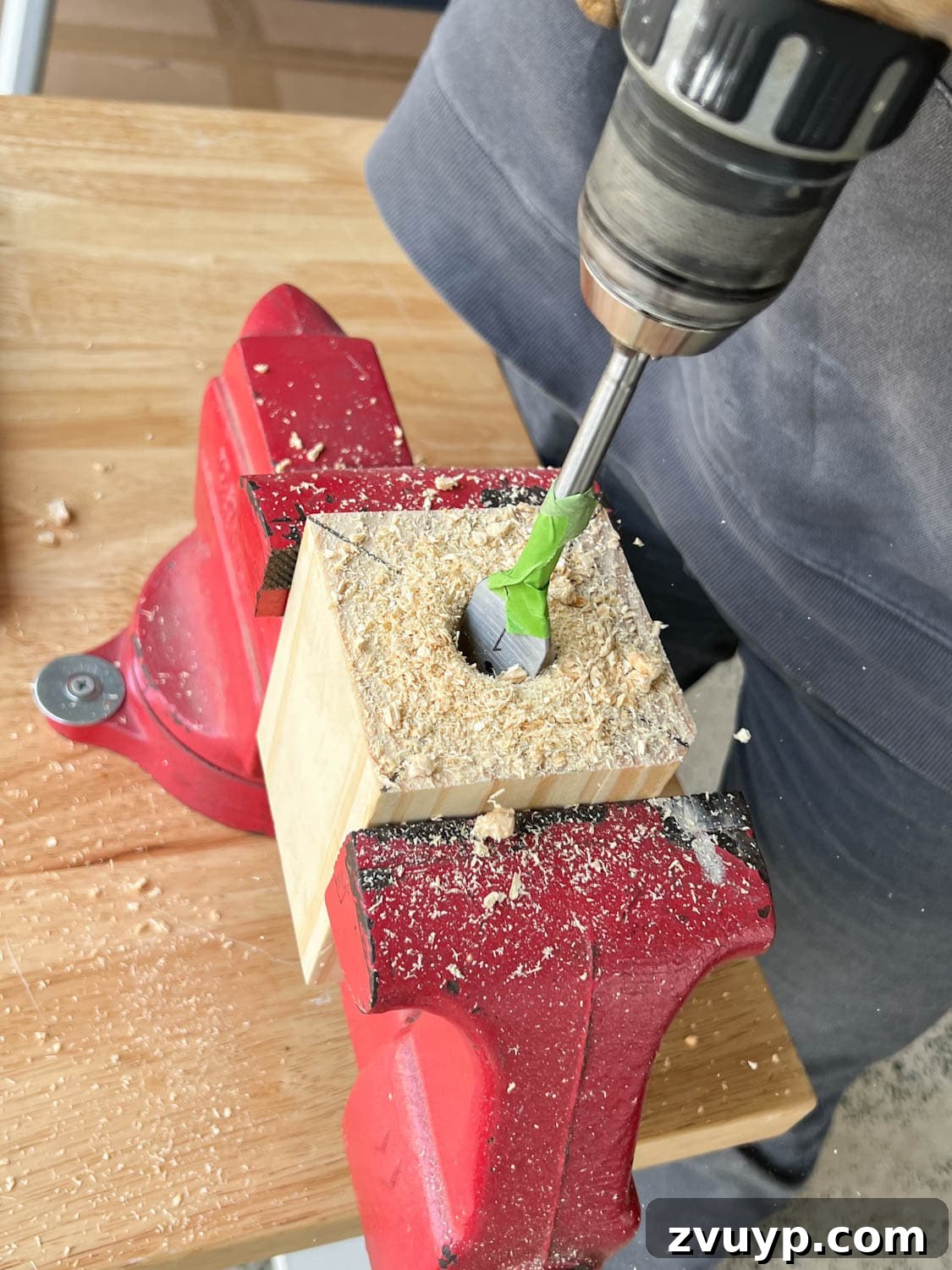 DIY Stair Spindle Swap For A Modern Makeover 20 Drilling the post hole into a new wood block mount for the new newel post