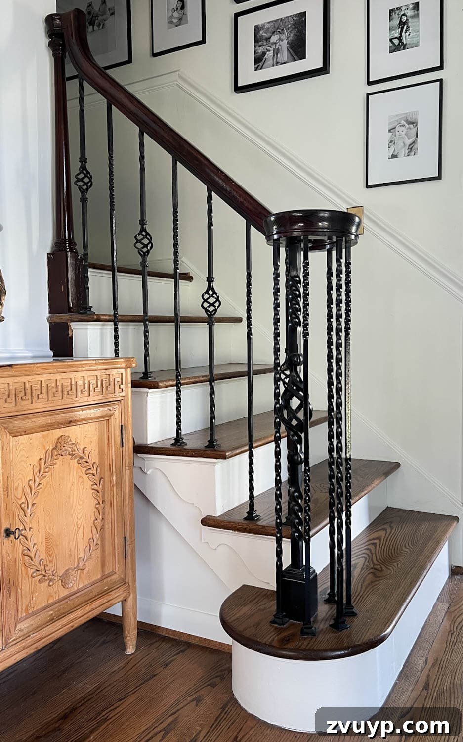 DIY Stair Spindle Swap For A Modern Makeover 3 Close-up of old twisted iron balusters on a stair railing before the makeover