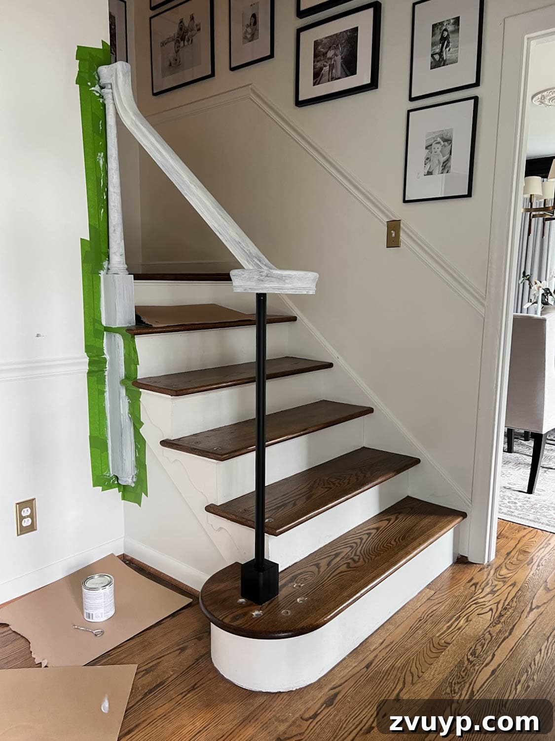 DIY Stair Spindle Swap For A Modern Makeover 22 Applying bonding primer to a stair railing with a professional quality brush