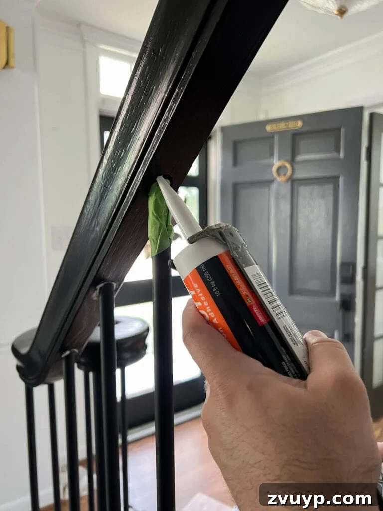 DIY Stair Spindle Swap For A Modern Makeover 27 Reinforcing stair balusters with construction adhesive in the handrail