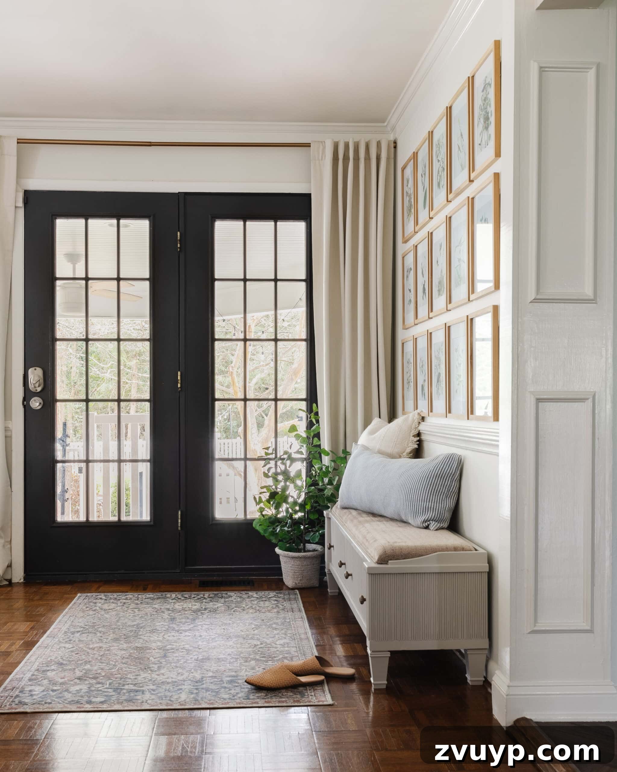 From Bland to Grand The Reeded Shoe Bench Makeover 2 Elegantly reeded shoe storage bench in a modern entryway featuring black doors and a curated gallery wall, showcasing the transformative power of decorative reeding.