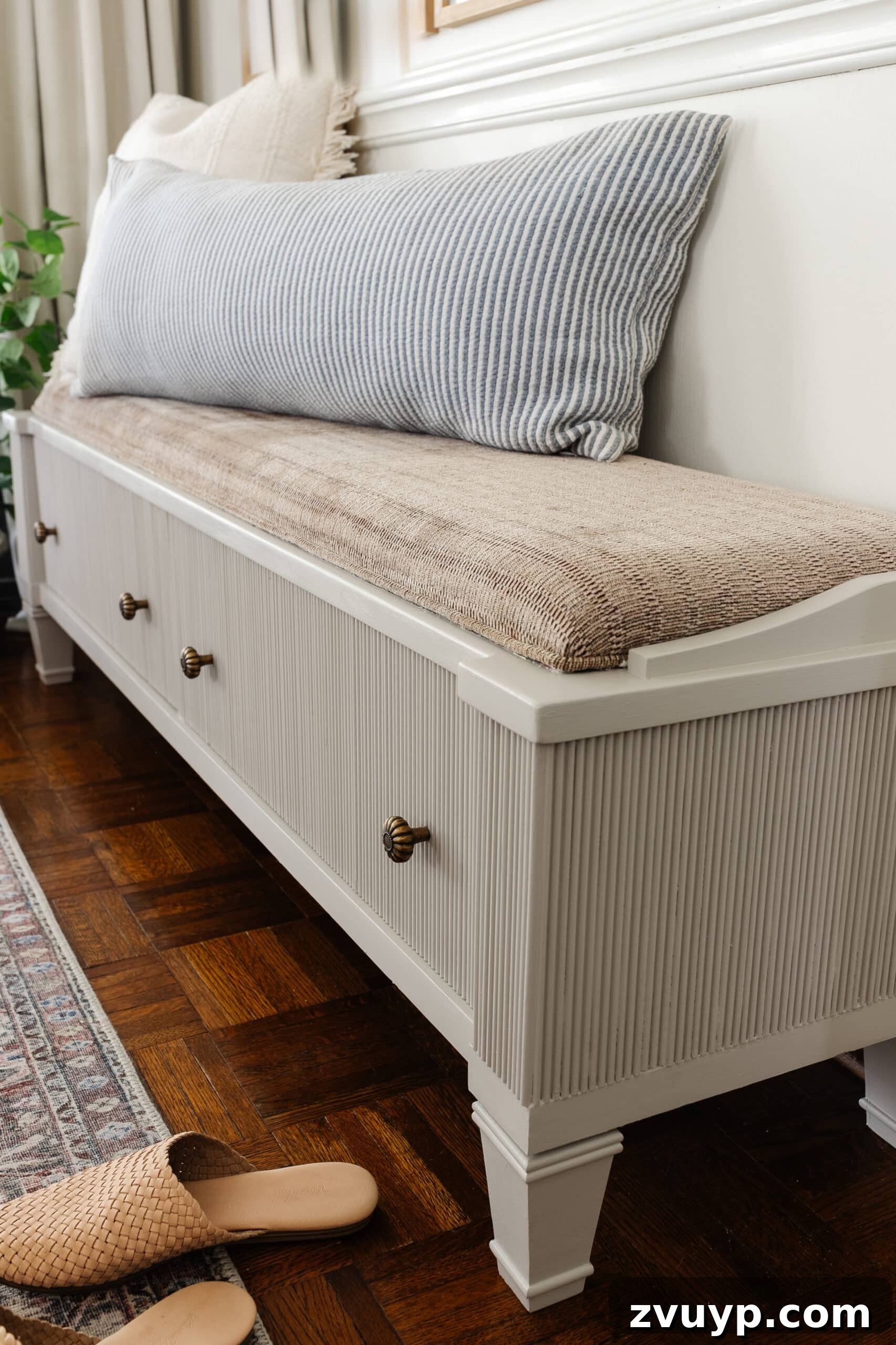 From Bland to Grand The Reeded Shoe Bench Makeover 17 The storage bench with decorative reeding now added, painted in Sherwin Williams Anew Gray, showcasing the new, elegant look in the entryway.