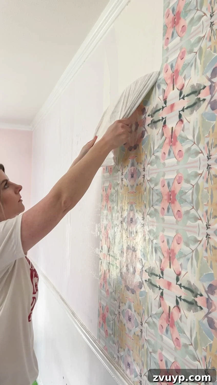 Mastering Wallpaper Removal: 3 Tried and True Methods 16 Removing wallpaper that has been sprayed with a DIY fabric softener solution