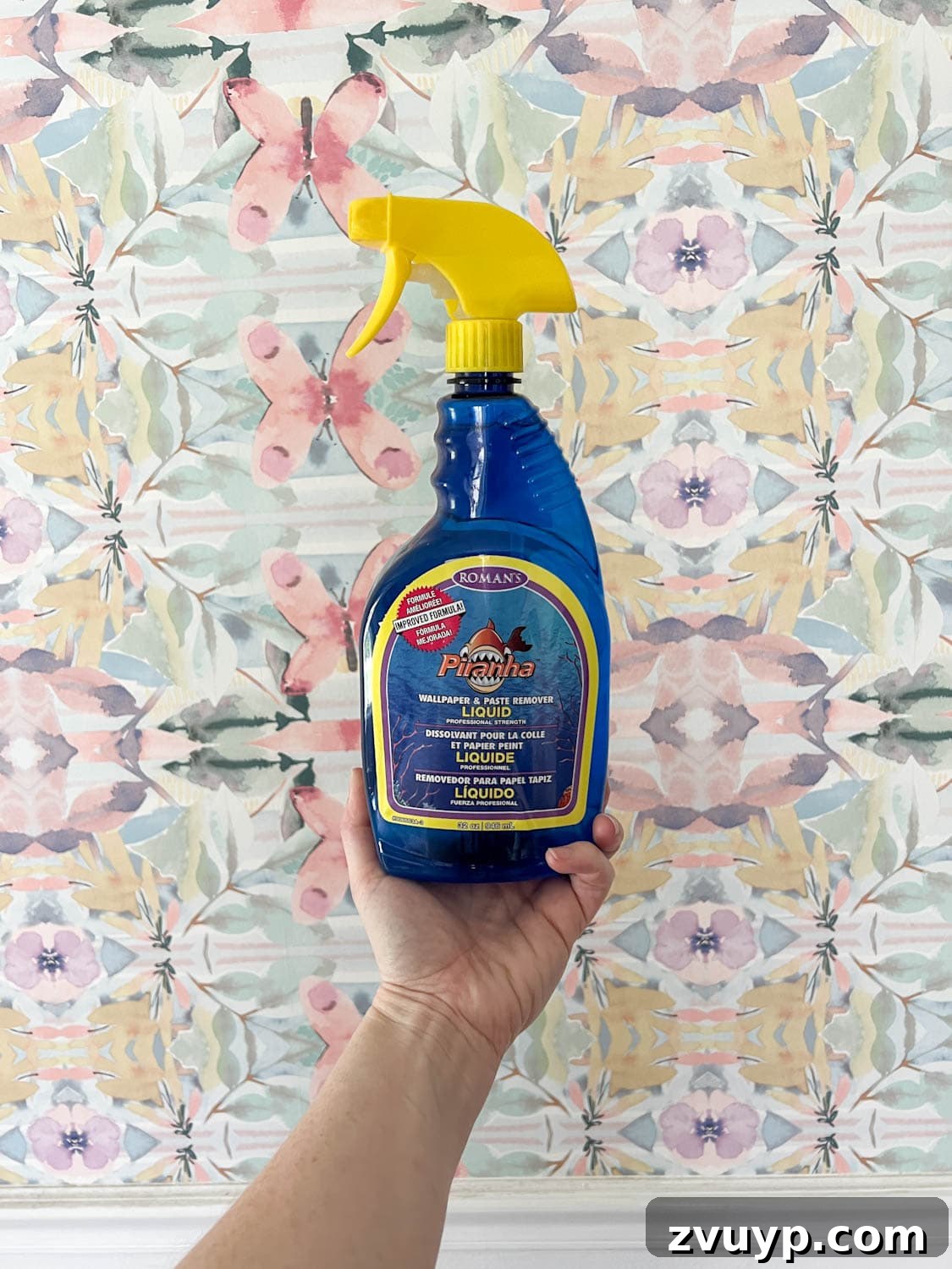 Mastering Wallpaper Removal: 3 Tried and True Methods 10 Applying store-bought wallpaper stripper to the wall