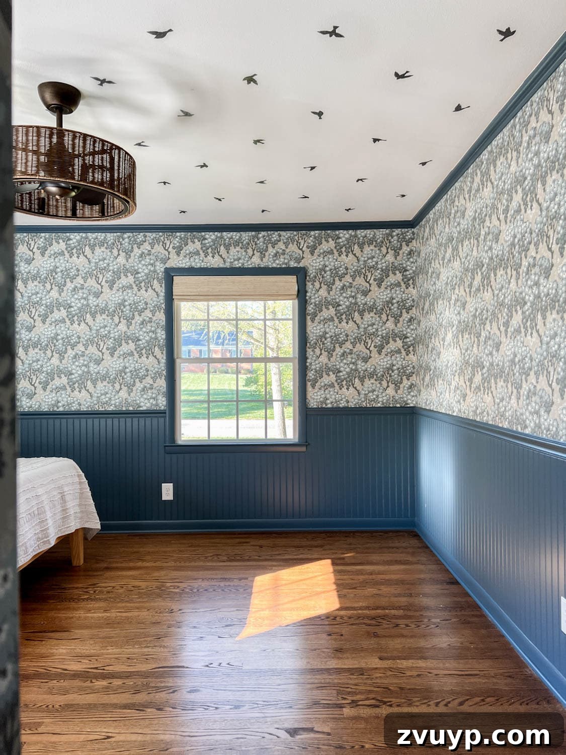 DIY Faux Block Print Ceiling Vinyl Decal Wallpaper 2 Whimsical faux bird wallpaper ceiling created with vinyl decals in a block print style, complemented by vintage floral wallpaper and dark blue beadboard walls in a girl's bedroom.