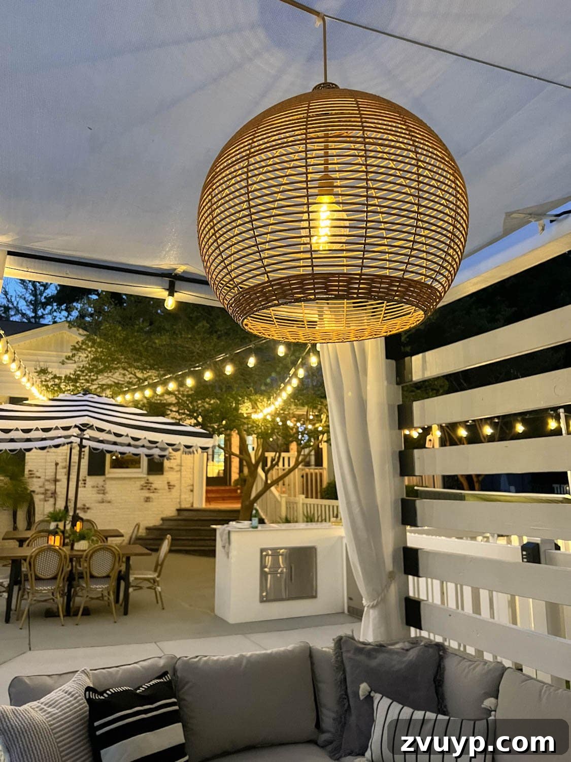 Effortless Backyard DIY: Create Your Dream Outdoor Space on a Budget 4 solar pendant light illuminating an outdoor dining area, showcasing efficient and stylish lighting