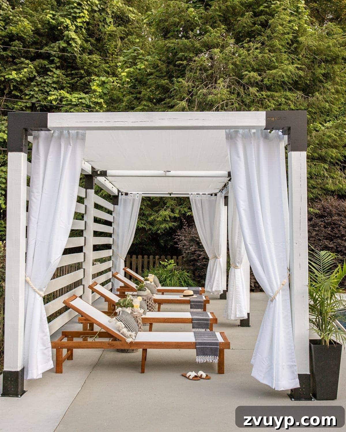 Effortless Backyard DIY: Create Your Dream Outdoor Space on a Budget 34 pergola adorned with elegant white UV protected outdoor curtains, providing shade and a refined look
