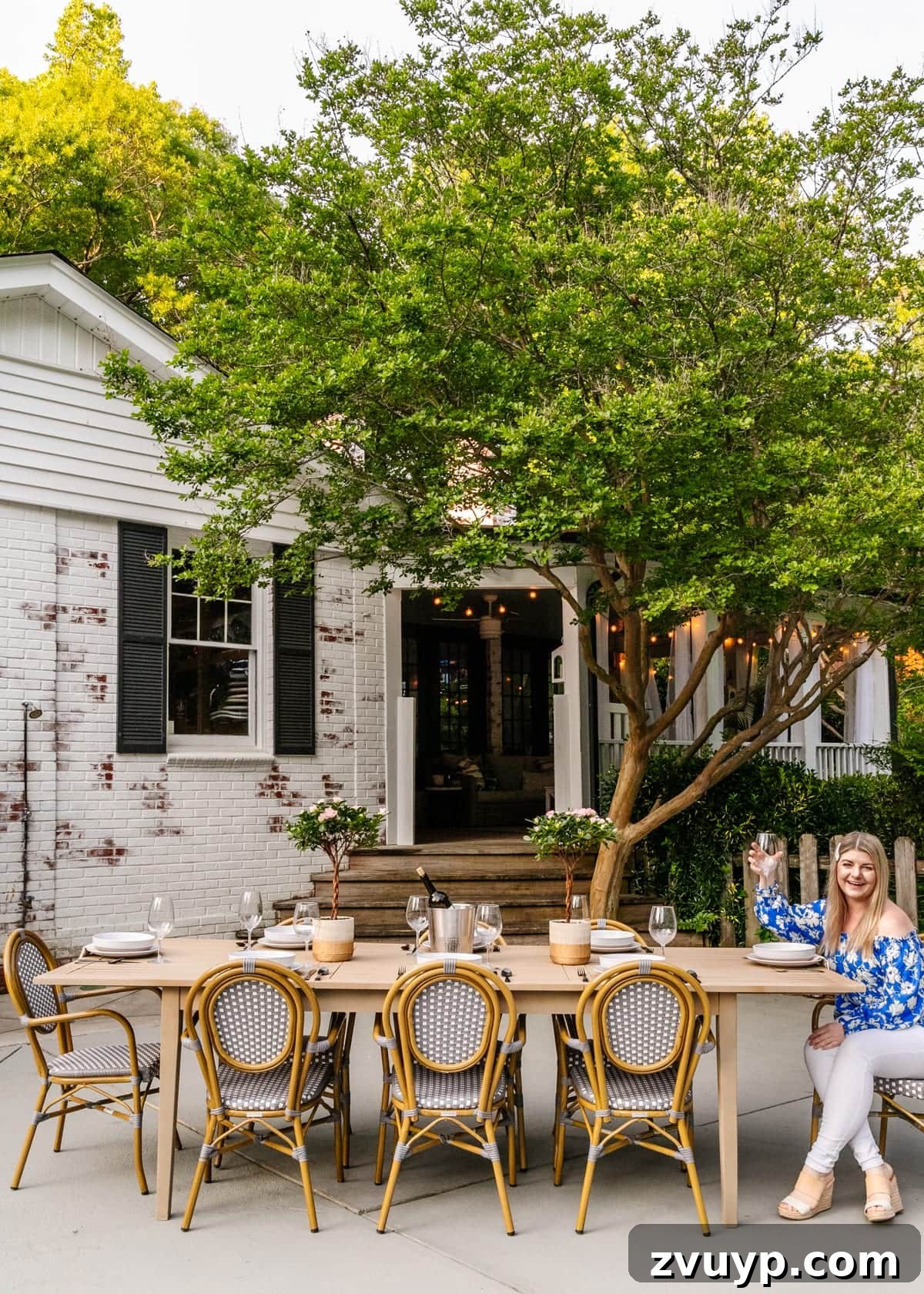 Effortless Backyard DIY: Create Your Dream Outdoor Space on a Budget 41 outdoor dining table painted to look like driftwood on a patio, mimicking a high-end coastal aesthetic