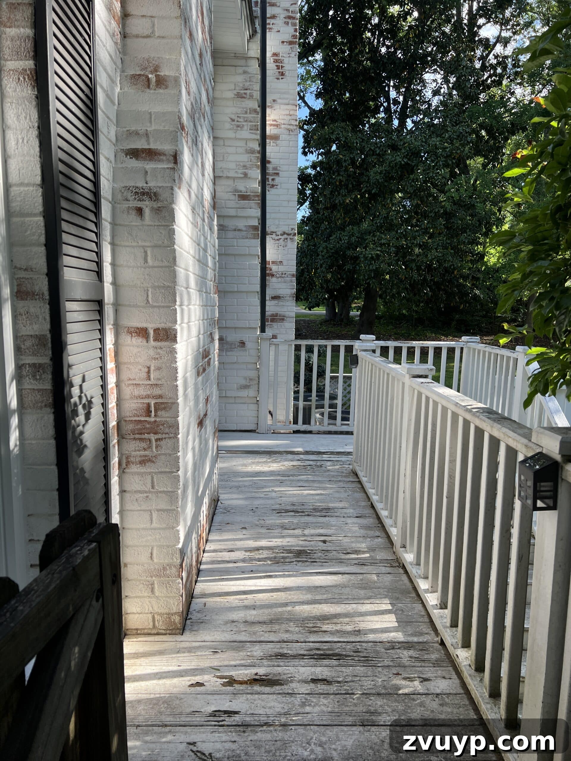Effortless Backyard DIY: Create Your Dream Outdoor Space on a Budget 45 side porch deck after a fresh coat of paint, looking clean and updated