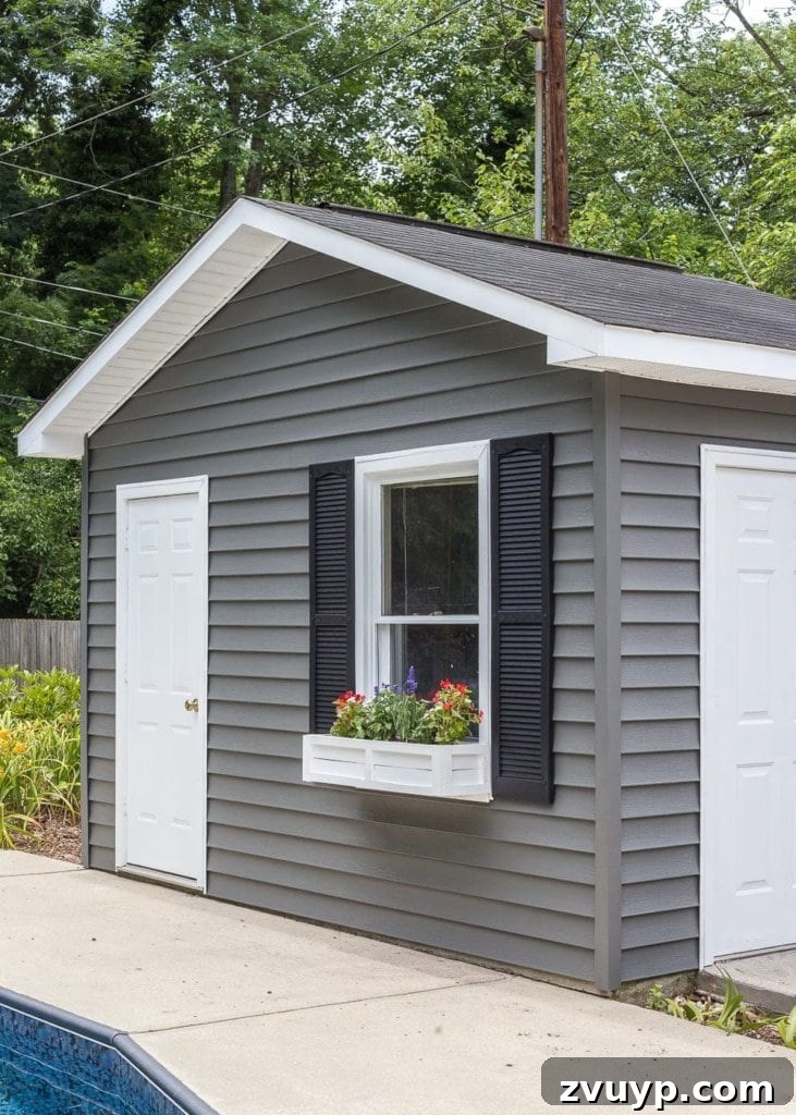 Effortless Backyard DIY: Create Your Dream Outdoor Space on a Budget 9 freshly painted vinyl siding on a backyard shed, showcasing a vibrant and renewed appearance