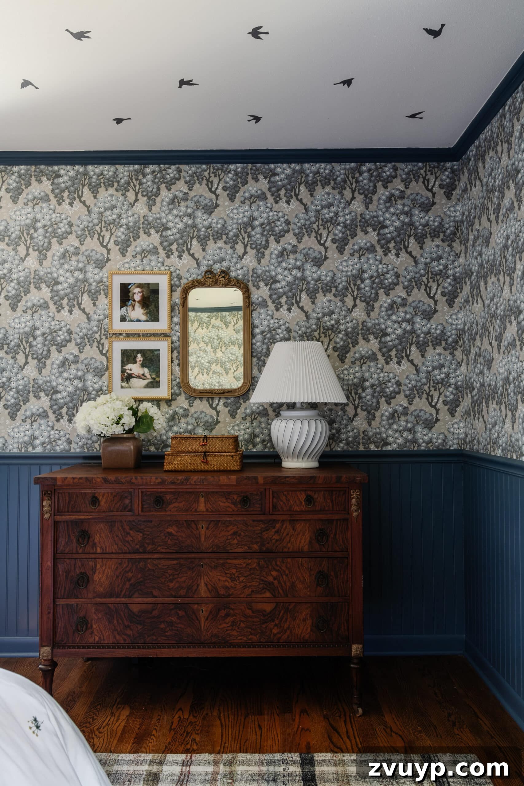 Dreamy Blue Bedrooms: Teen Girl Decorating Ideas and Room Tour 17 burl wood dresser with swedish cottage style wallpaper and gallery wall with mirror and altered portraits
