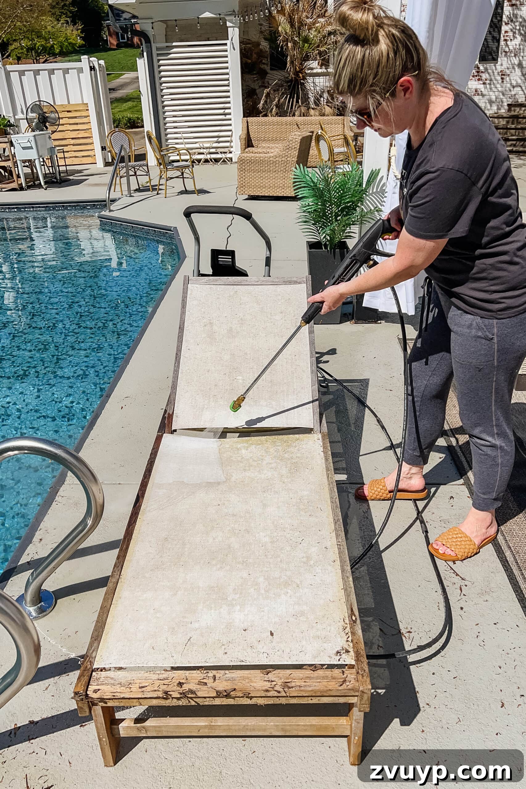 Effortless Spring Patio Refresh 21 cleaning patio furniture with a pressure washer to remove mildew and dirt