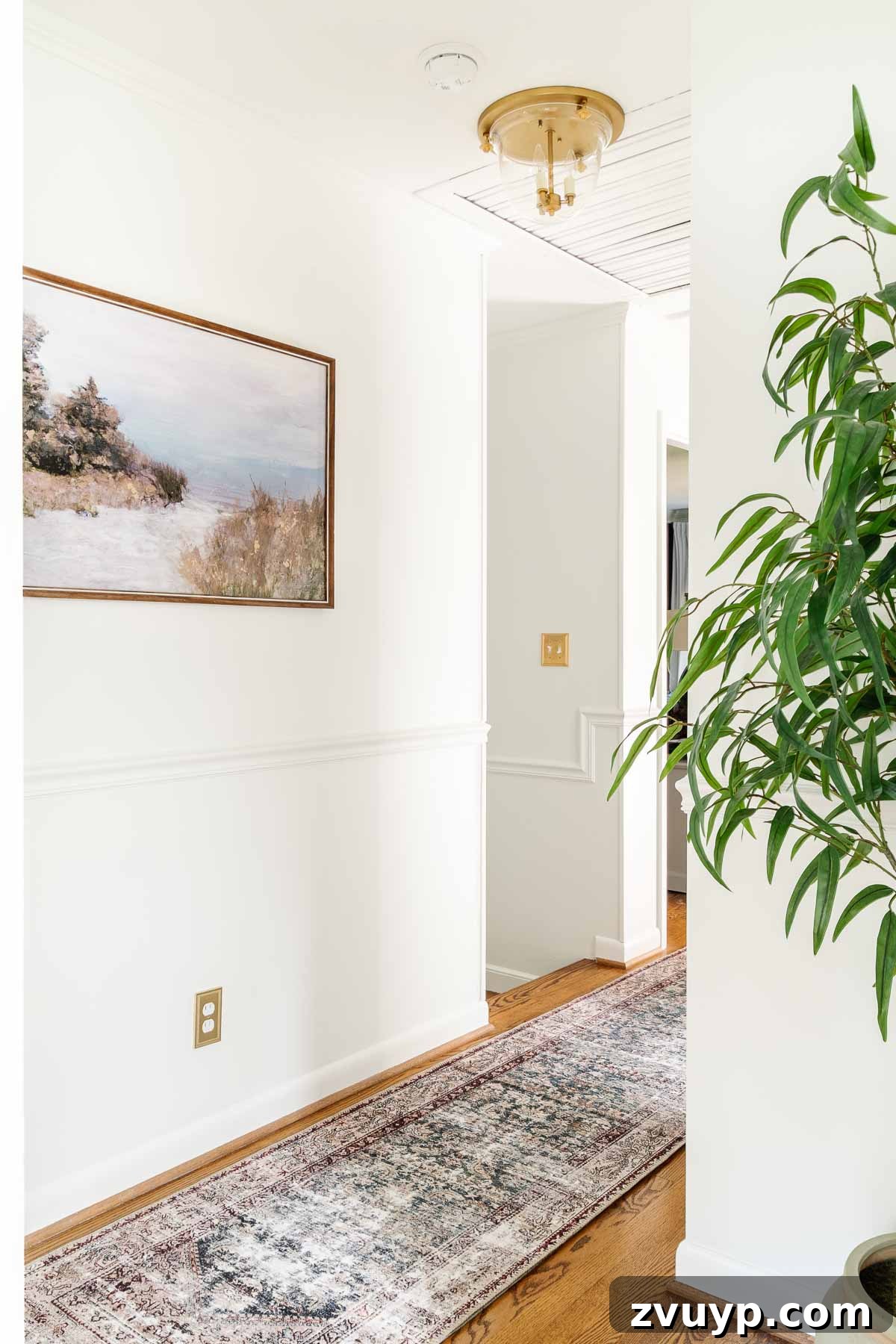 Timeless Traditional Rugs from Loloi 5 Hallway featuring a long, traditional Loloi rug from the Amber Lewis collection, adding color and pattern to the narrow space and guiding the eye.