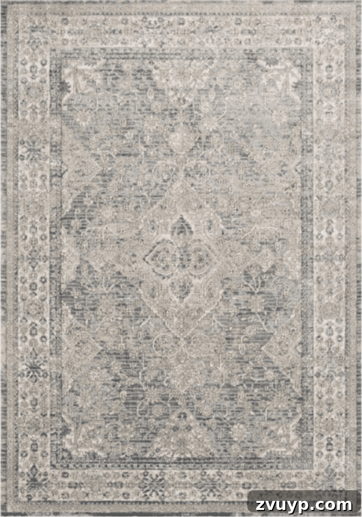 Timeless Traditional Rugs from Loloi 10 Close-up of the Loloi II Teagan Oriental Sky/Natural rug, showing its intricate low-pile texture and beautiful blend of blue and green tones.