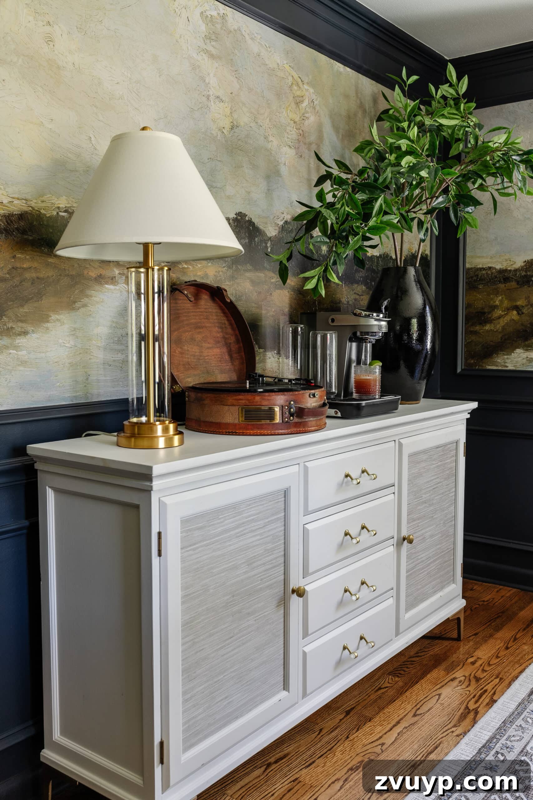 Bartesian Cocktail Maker Review: Is It Worth It? 10 dining room buffet with Bartesian cocktail machine, record player, vase of branches, and lamp