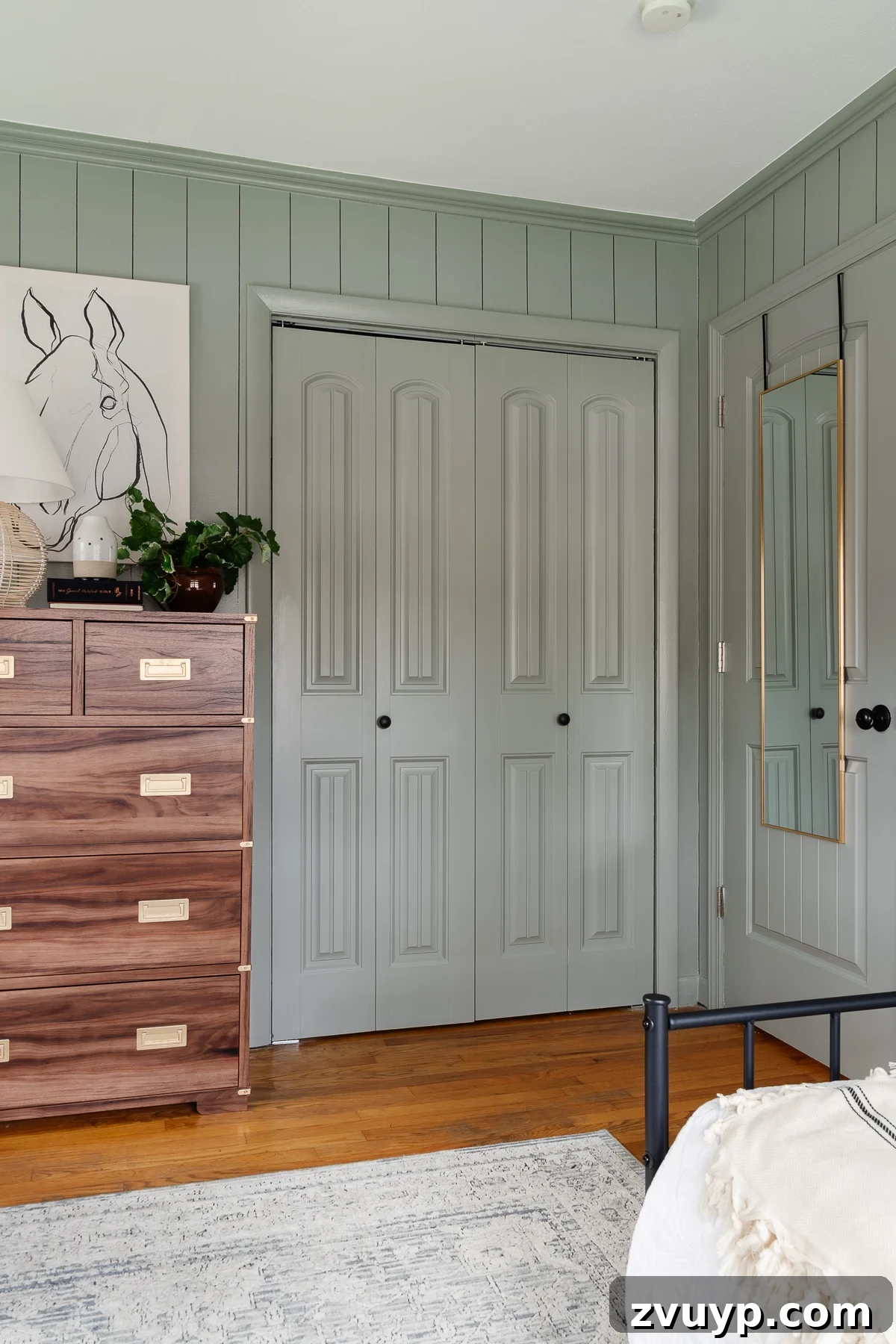 24 Clever Organization and Design Tips for Kids Spaces 30 doors in a bedroom painted Sherwin Williams Evergreen Fog with full mirror hanging on the back