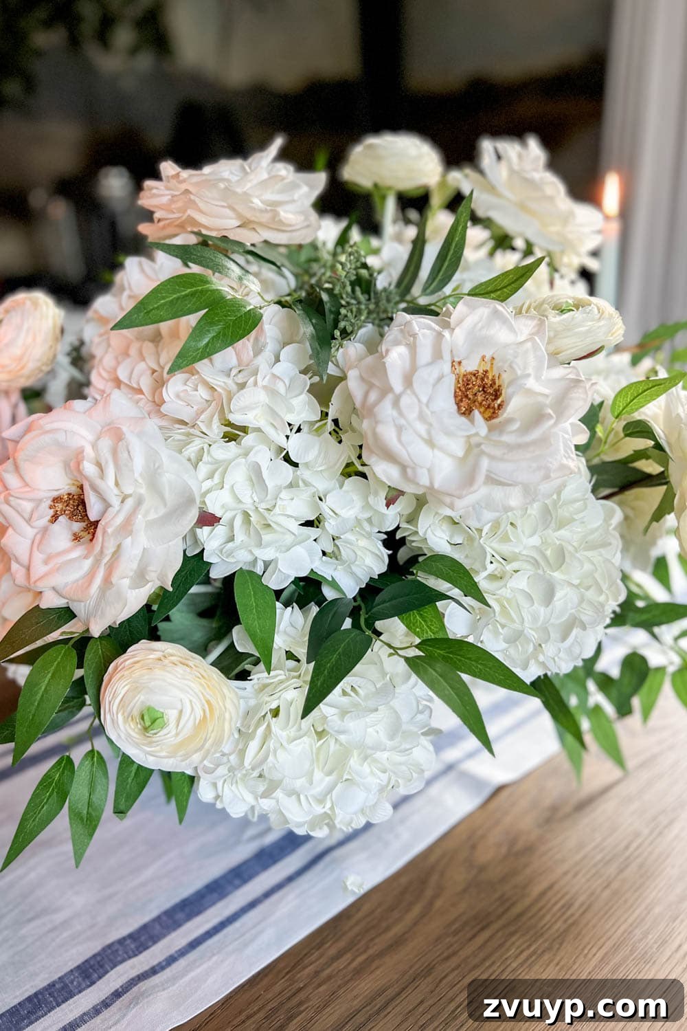Effortless Charm DIY Faux Flower Creations 18 classic DIY flower arrangement with fake hydrangeas, roses, ranunculus, ruscus, and eucalyptus