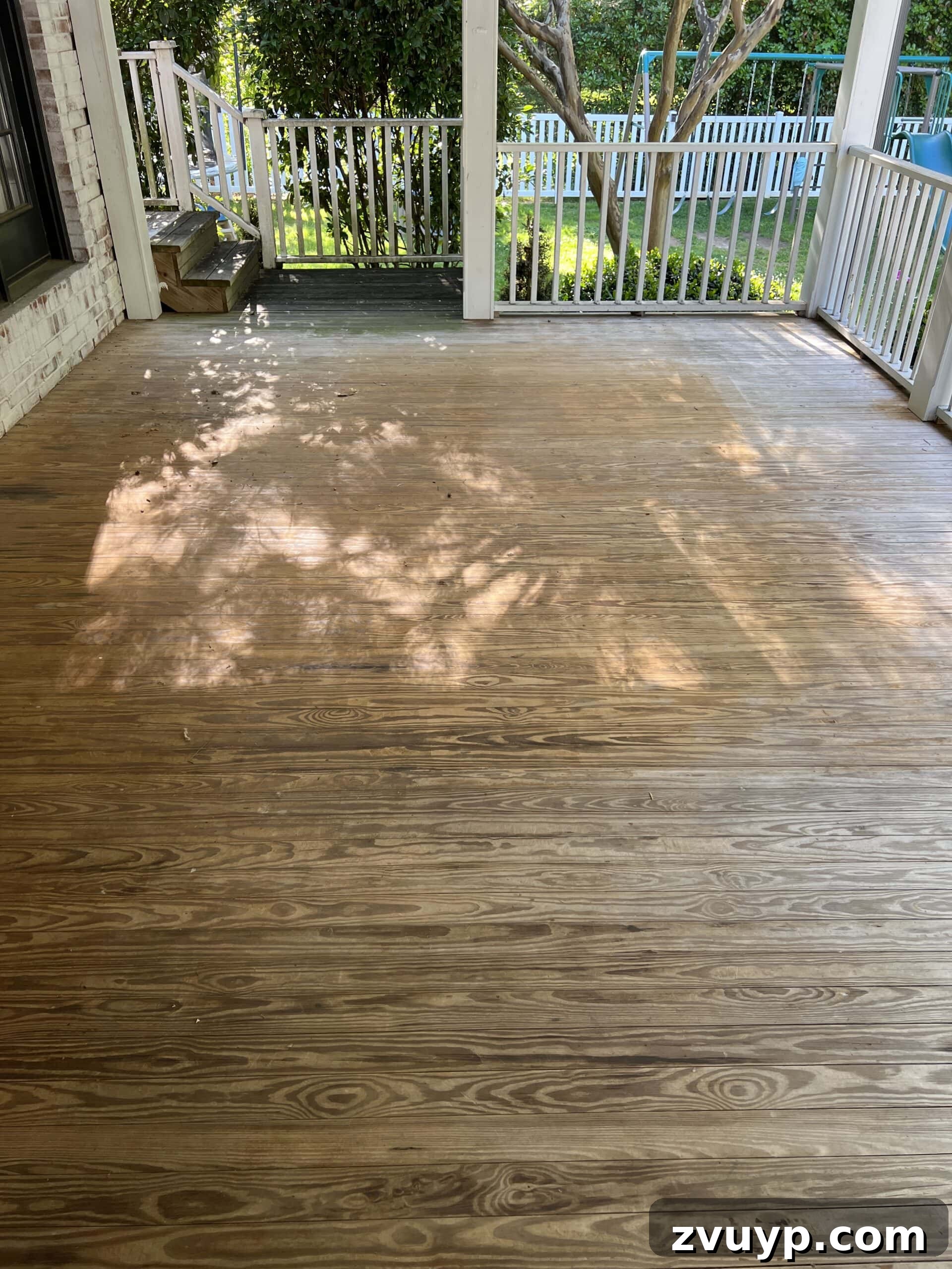 Selecting the Perfect Deck Stain for a Neutral Driftwood Finish 3 old wood porch floor before refinishing with deck stain