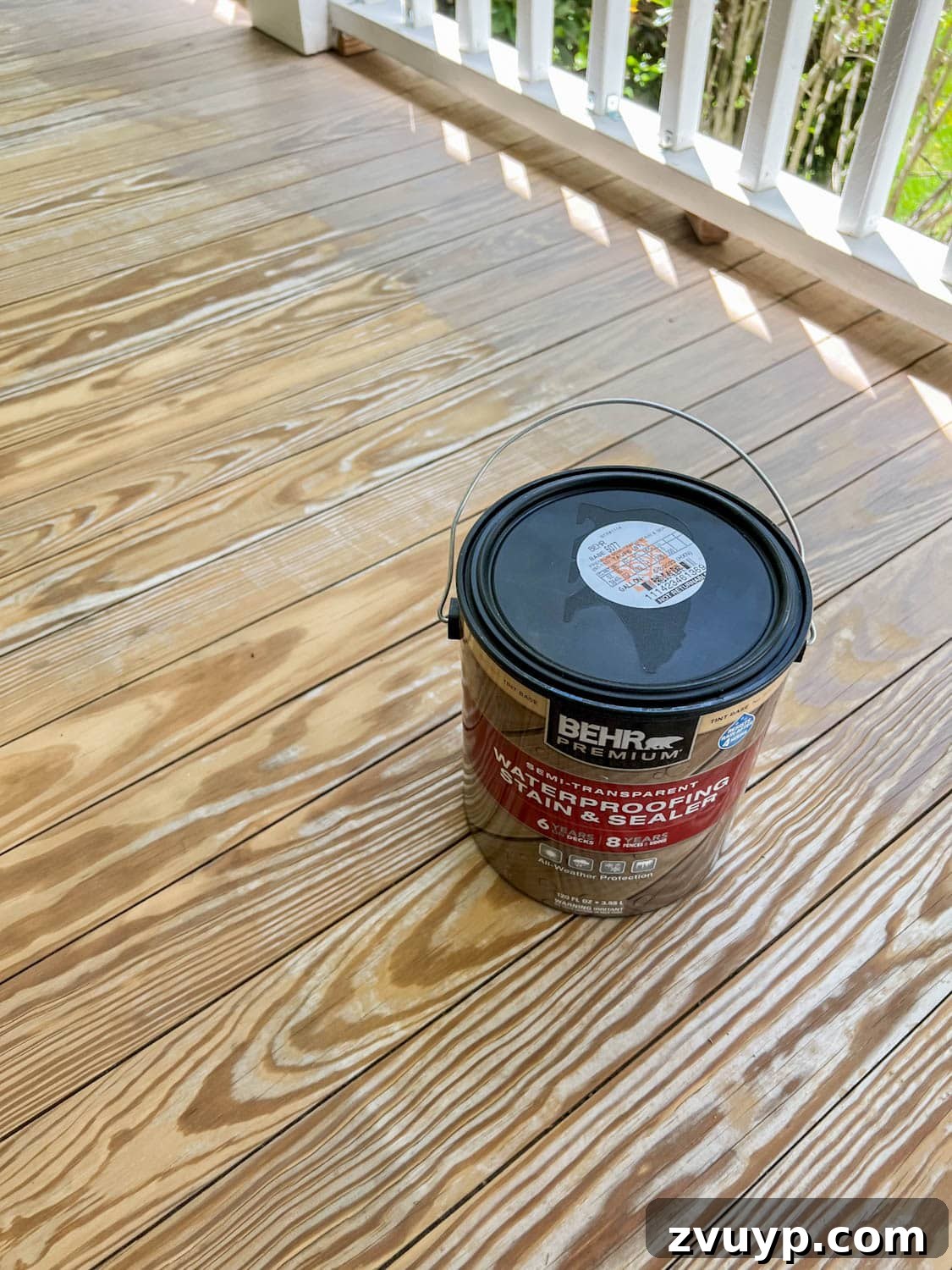 Selecting the Perfect Deck Stain for a Neutral Driftwood Finish 6 Behr Semi-Transparent Waterproofing Stain and Sealer in Taupe on an old wood deck