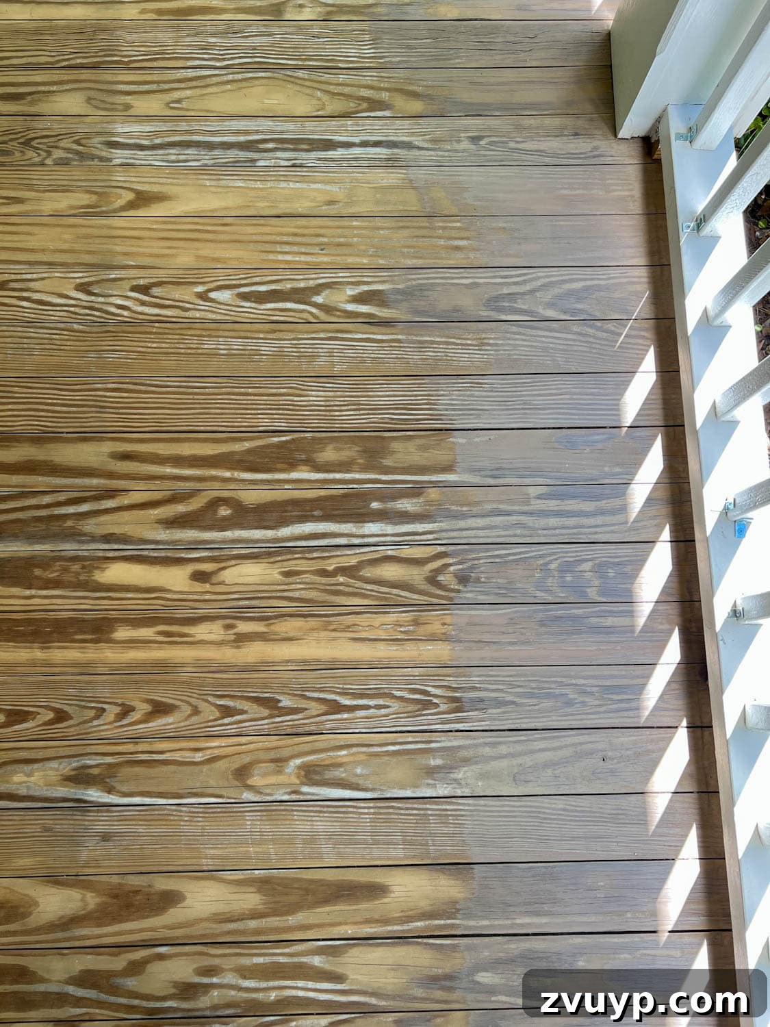 Selecting the Perfect Deck Stain for a Neutral Driftwood Finish 8 brushing Behr Taupe stain color on old deck wood, removing yellow tones