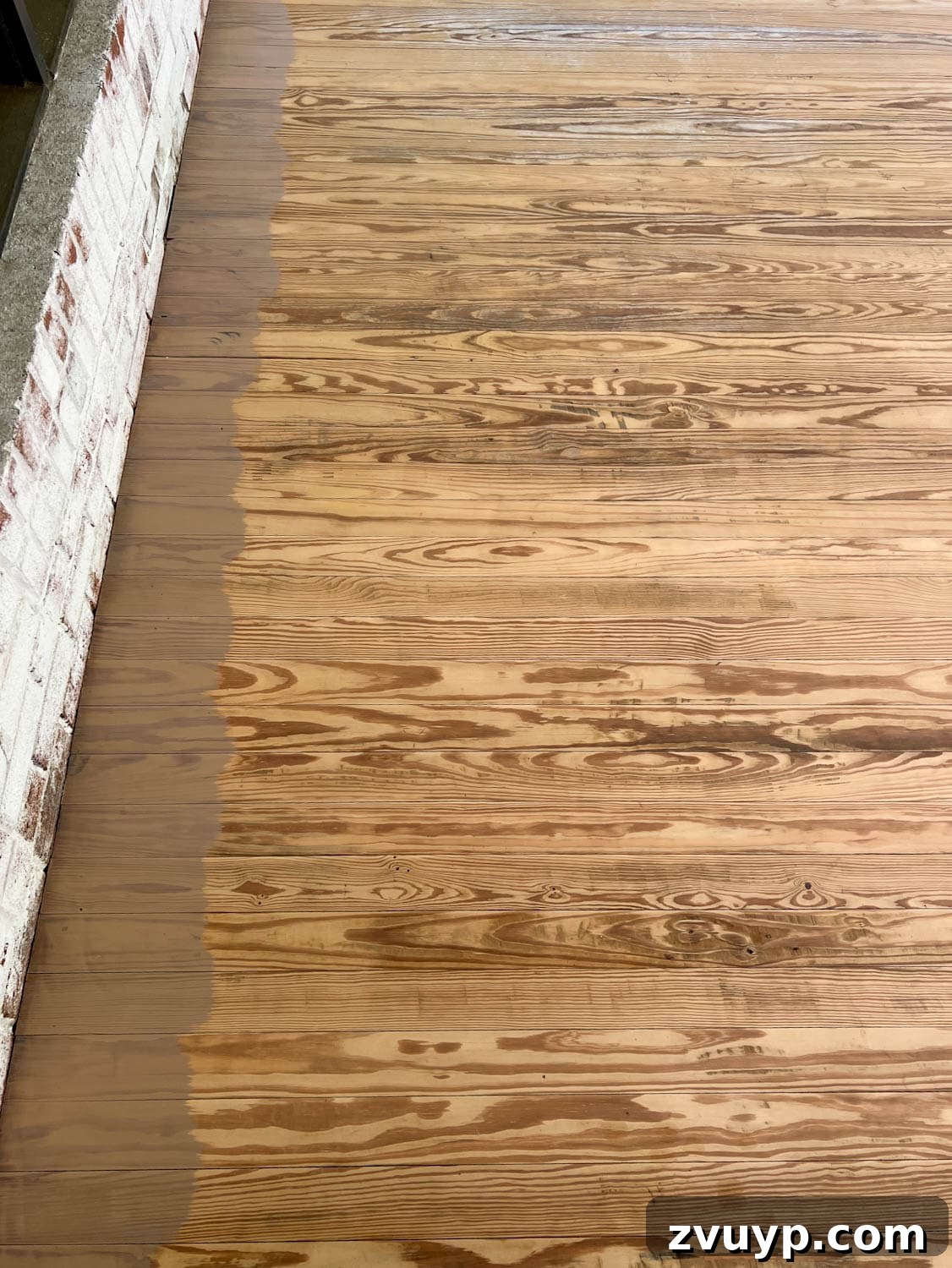 Selecting the Perfect Deck Stain for a Neutral Driftwood Finish 9 brushing Behr Taupe stain color on old deck wood