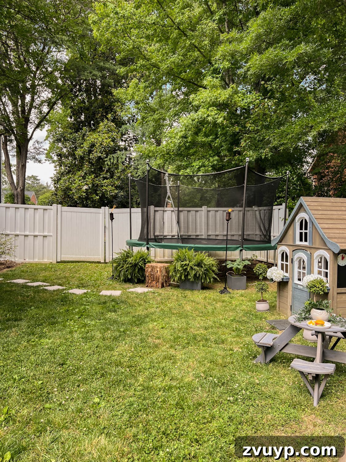 Transform Your Side Yard: 8 Play Area & Trampoline Design Ideas 14 side yard with stepping stones leading to an outdoor trampoline, showcasing the full transformation