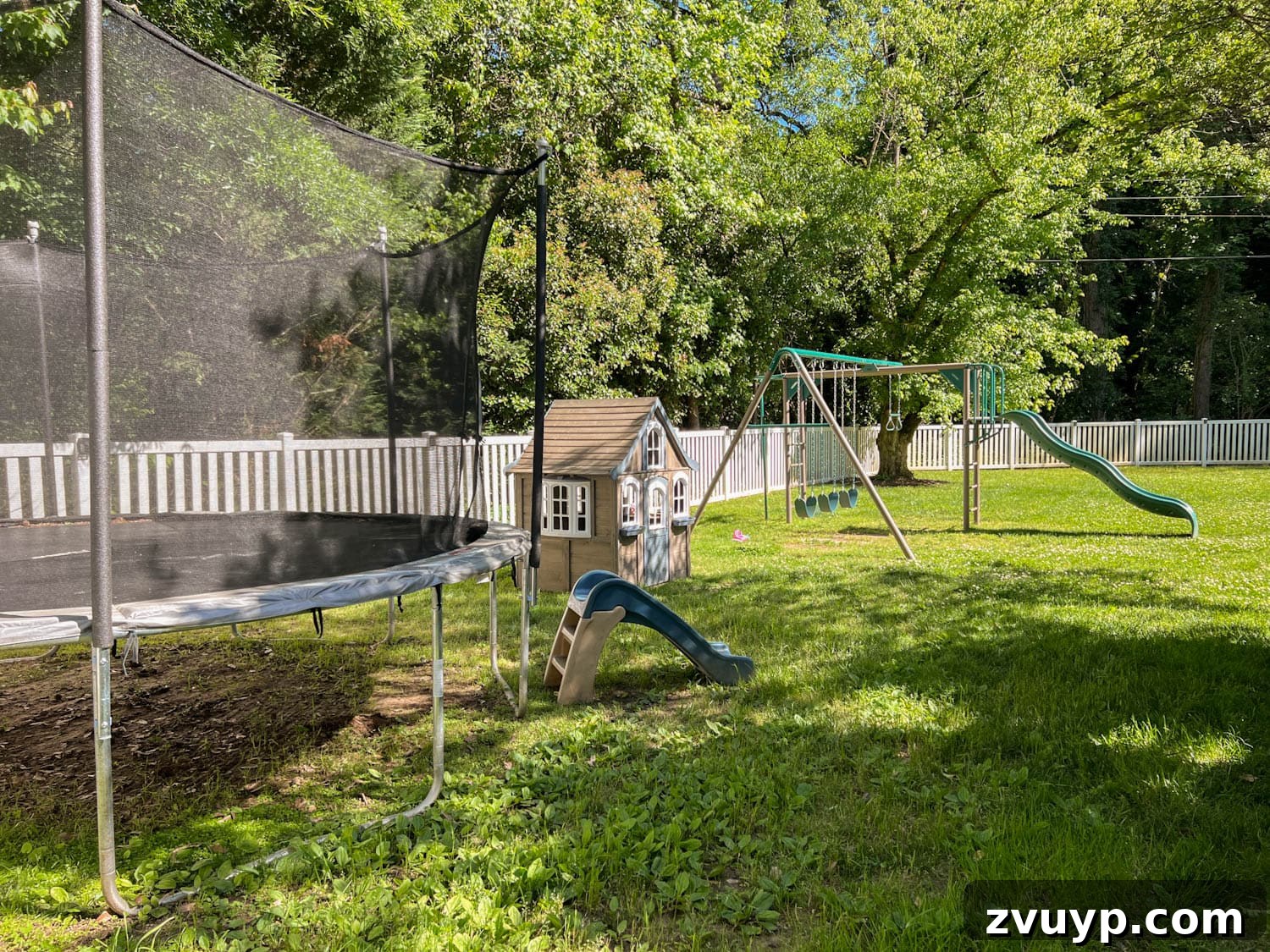 Transform Your Side Yard: 8 Play Area & Trampoline Design Ideas 3 side yard play area before - showing muddy ground and worn trampoline