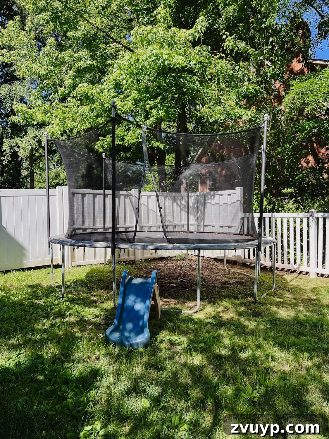 Transform Your Side Yard: 8 Play Area & Trampoline Design Ideas 6 trampoline before - showing worn pad and bare ground