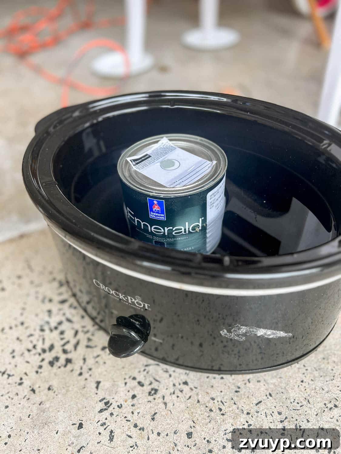 DIY Bedside Table Refresh: Secrets to Smooth Gloss Paint 8 warming a can of gloss enamel paint in a slow cooker filled with water for a smoother application