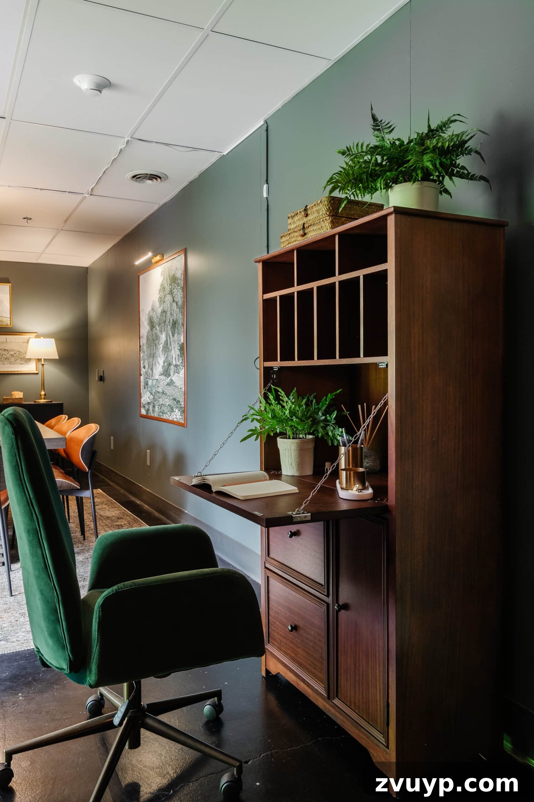 Transform Your Office: Cozy Conference Room Design Ideas 26 wooden secretary desk and green desk chair in an office