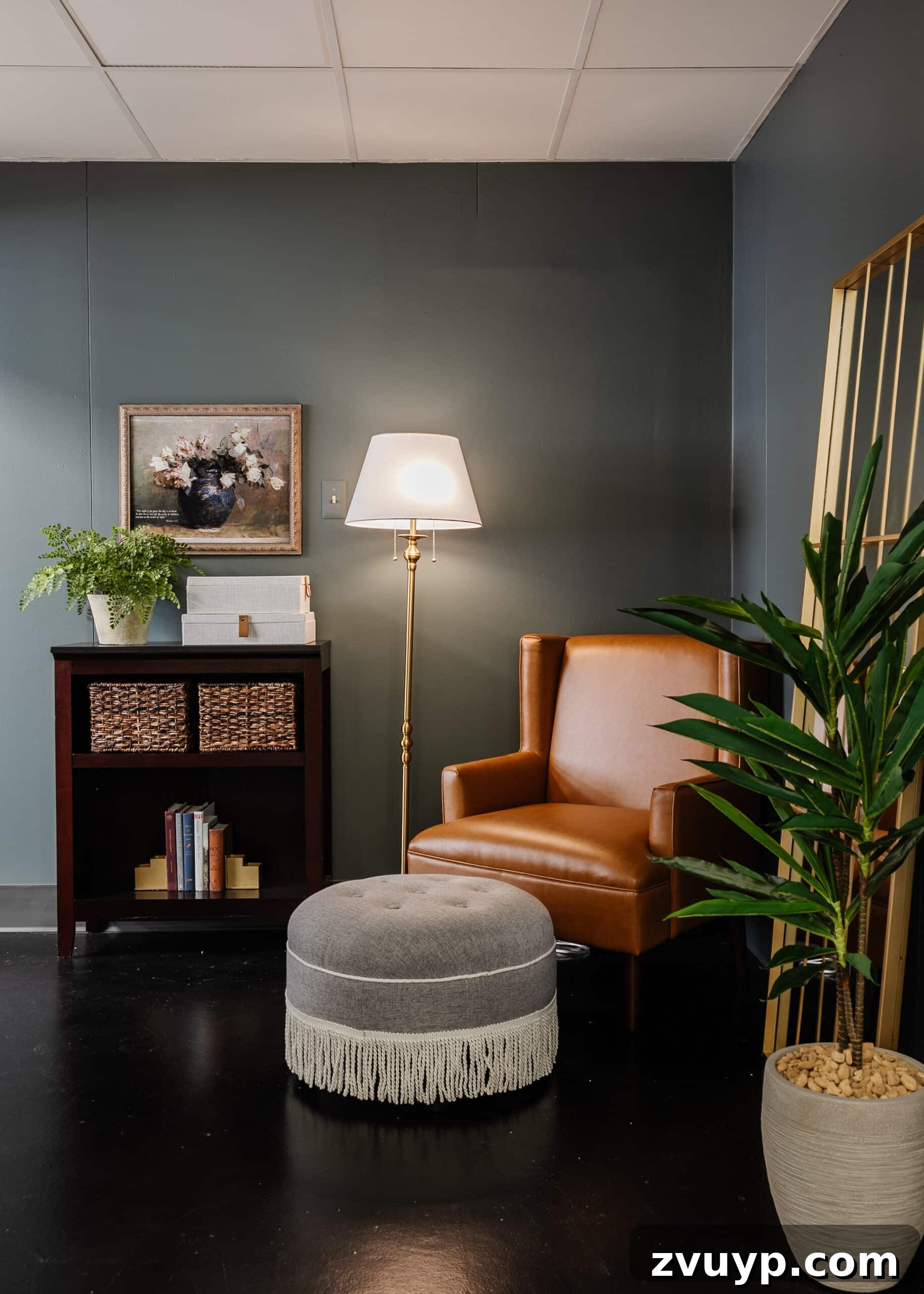 Transform Your Office: Cozy Conference Room Design Ideas 4 leather armchair and gray fringe footstool in a reading corner in an office