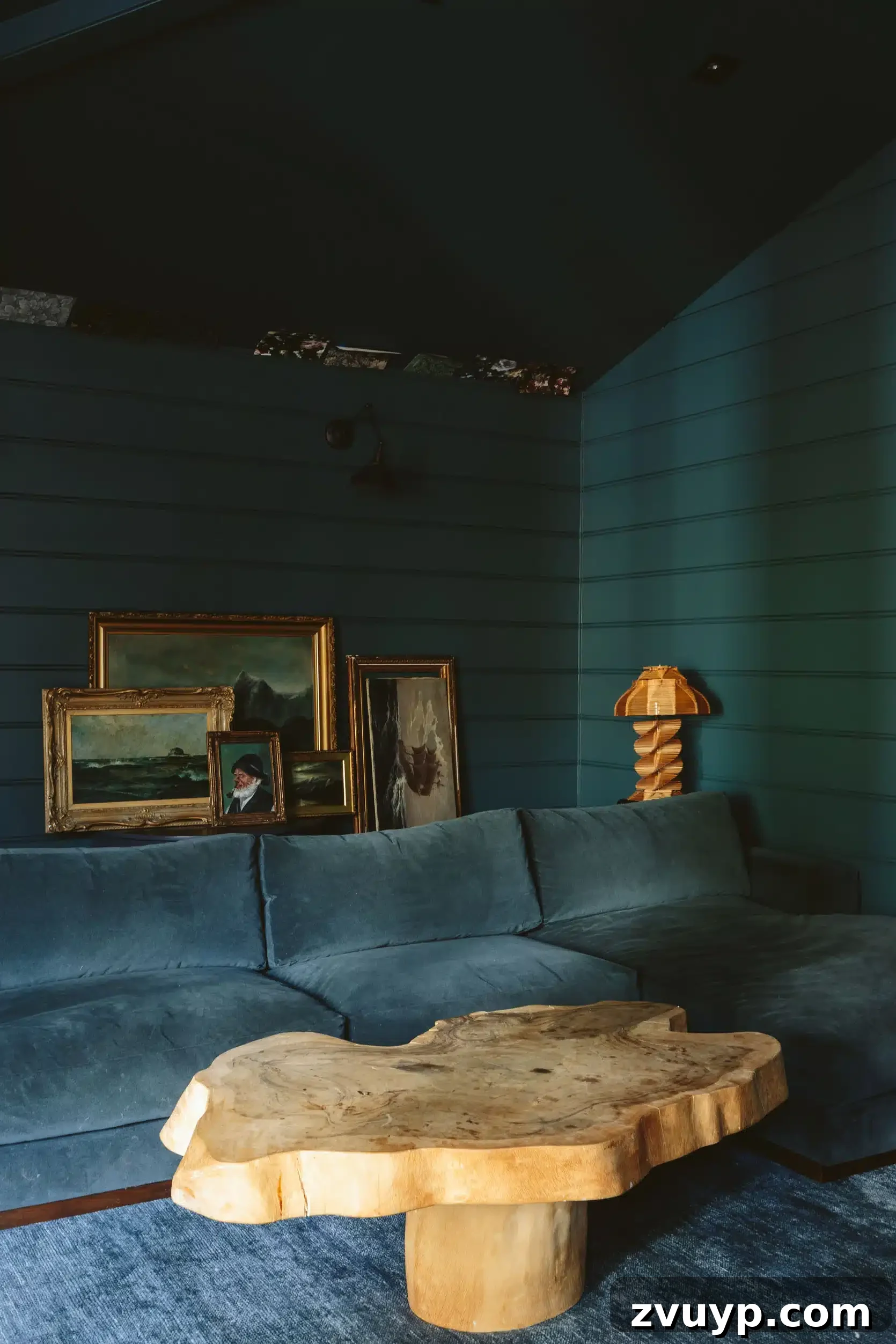 Sherwin Williams Still Water dark teal on shiplap wall in a family room for a serene touch