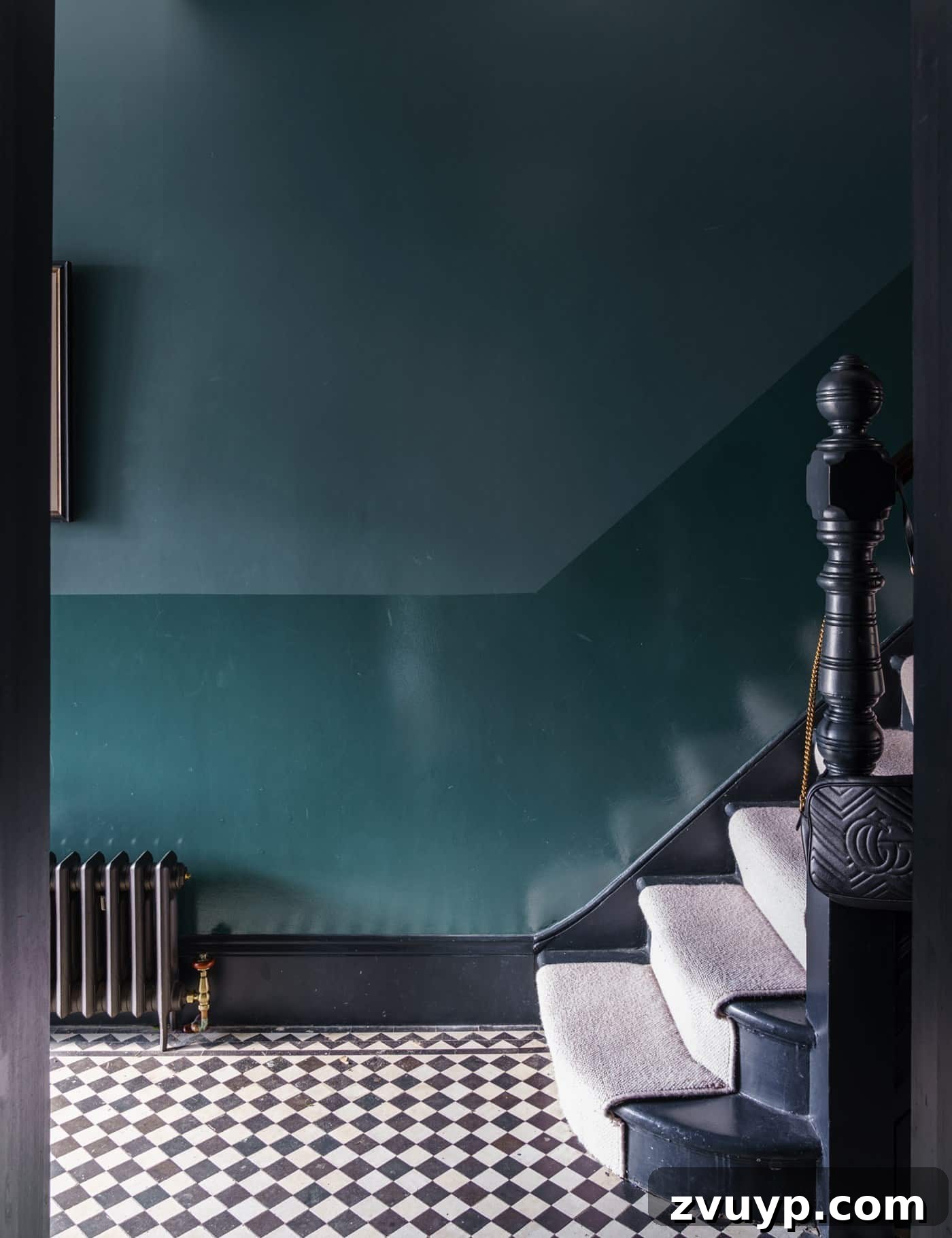 Dual sheen Farrow and Ball Inchyra Blue teal stairs and entryway creating a dramatic entrance