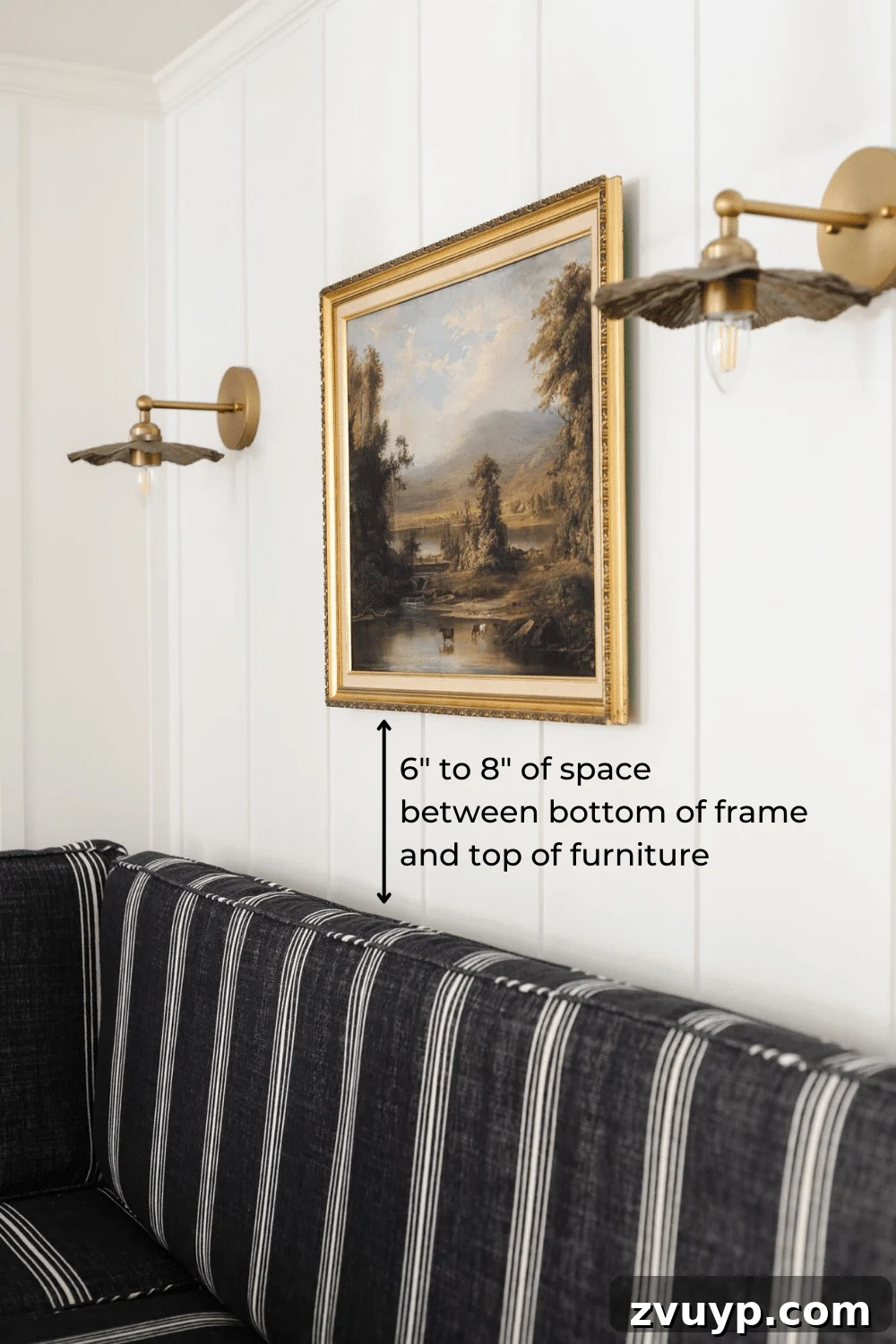 Hang Like a Pro: Avoid These Picture Frame Mistakes 13 Diagram illustrating the correct height for hanging a picture over furniture, maintaining an ideal gap.