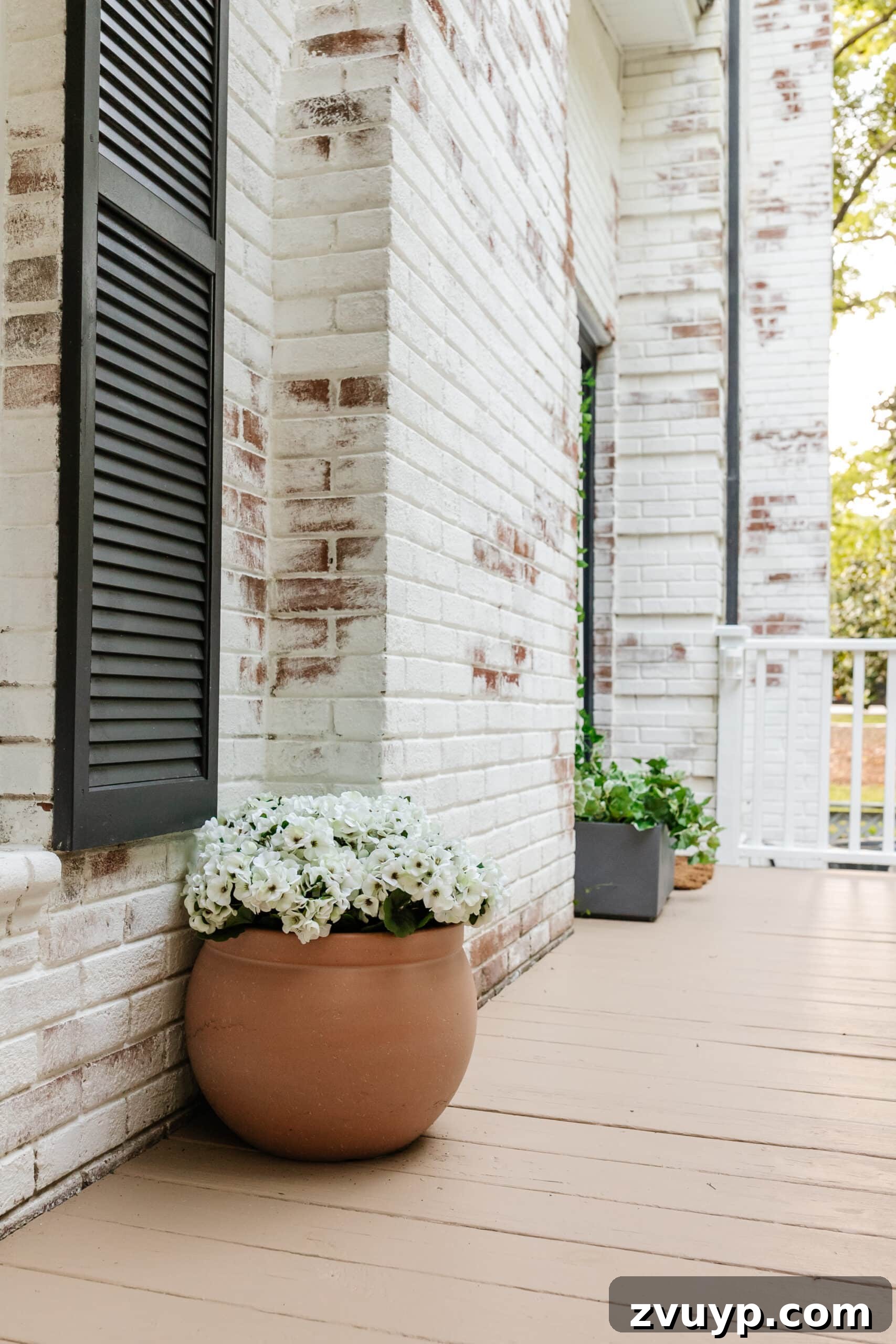 6 Small Side Porch Makeovers Before and After Inspiration 16 side porch makeover with terracotta planter of faux flowers