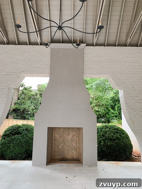 Portable Fireplace Builds for Any Setting 19 Stunning covered porch fireplace with elegant curved details
