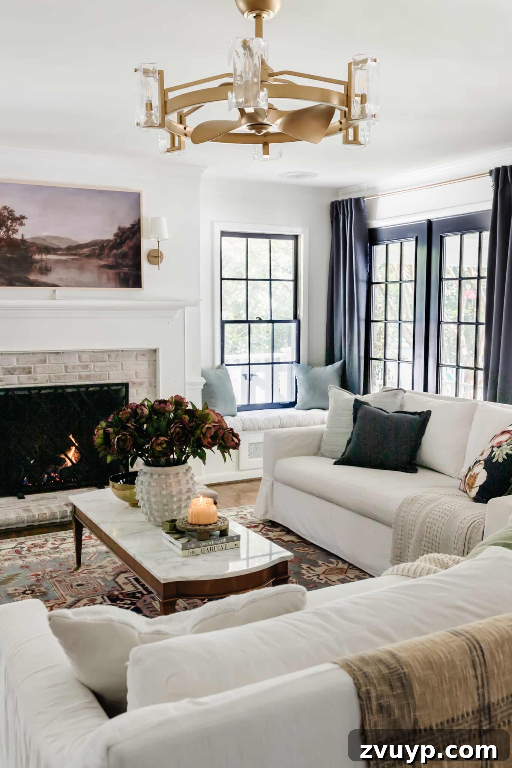 Your Living Room Decor Kickoff 2 fall living room with blue curtains, vintage rug, and fall art on tv above fireplace