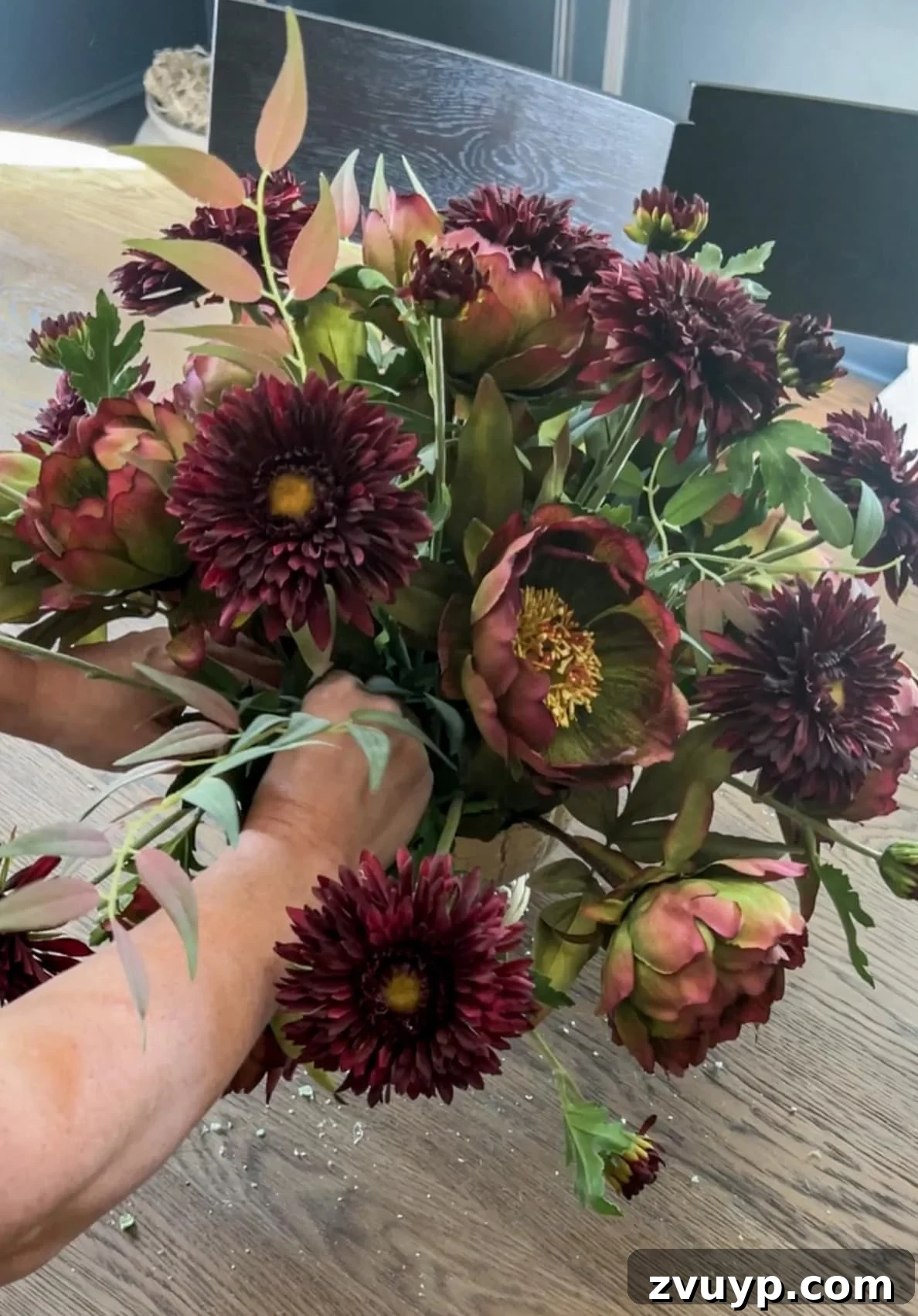 Autumn Blooms: Simple DIY Floral Arrangements 12 Carefully filling gaps with leafy greens to add volume and hide foam in a fall centerpiece