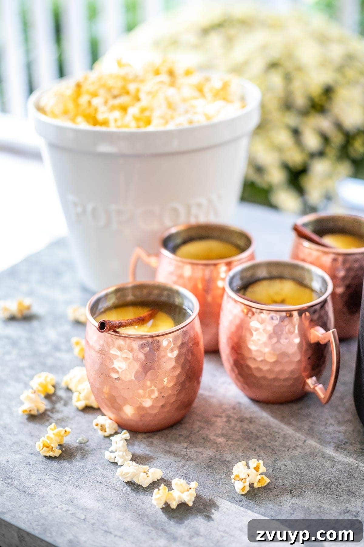 Fireside Fantasies: How to Host a Bonfire Party They'll Never Forget 10 bonfire party food serving popcorn and apple cider