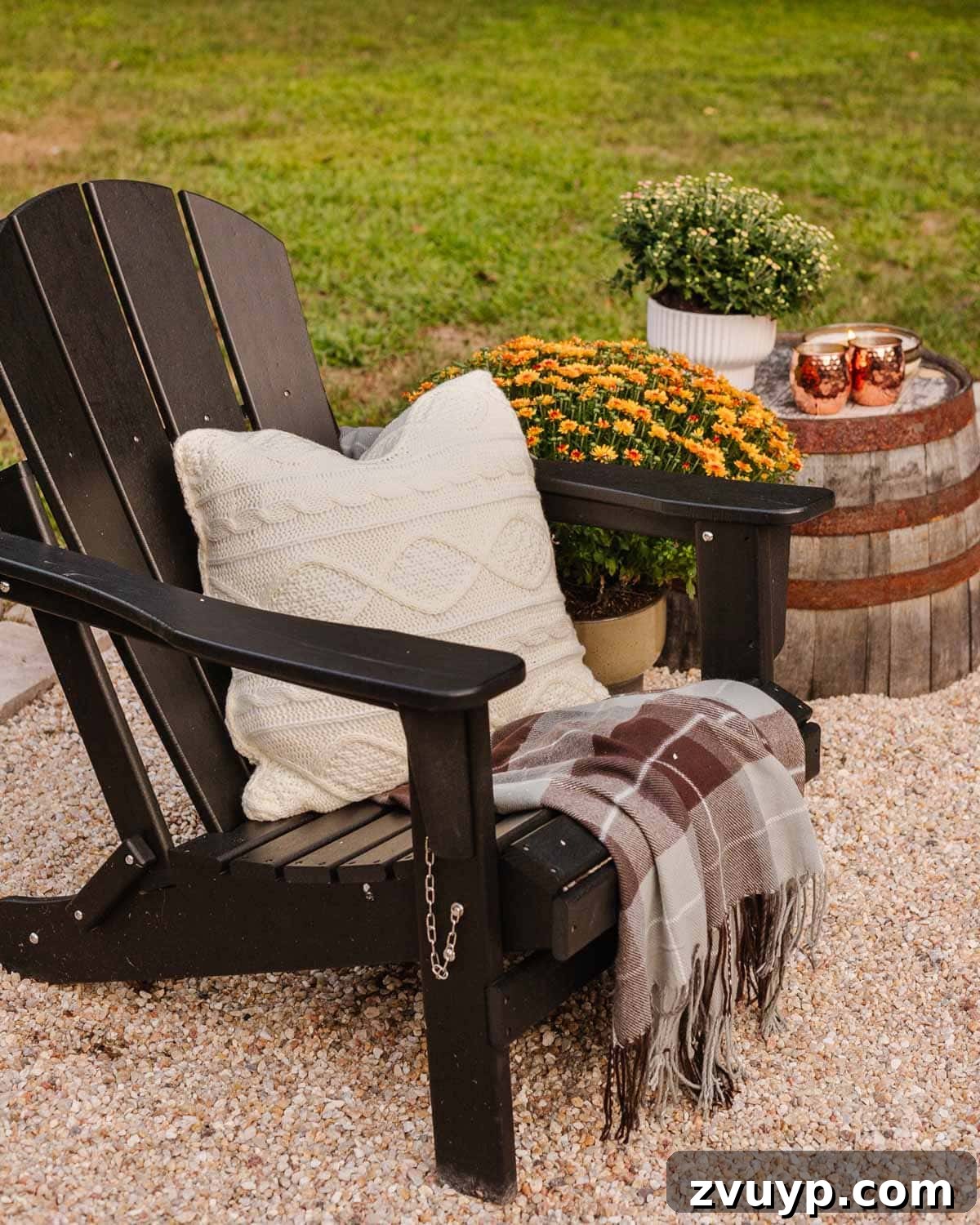 Fireside Fantasies: How to Host a Bonfire Party They'll Never Forget 6 blanket and pillow on an adirondack chair