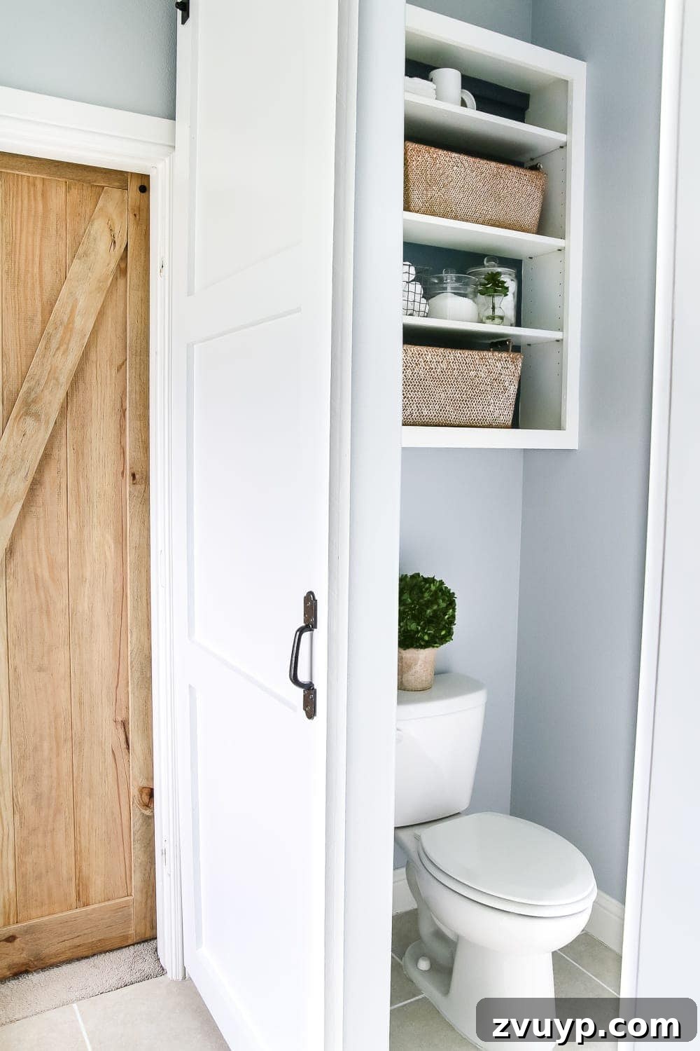 Small Bathroom Illusions: Design Tips for a Spacious Feel 11 Tiny toilet closet with vertical shelving