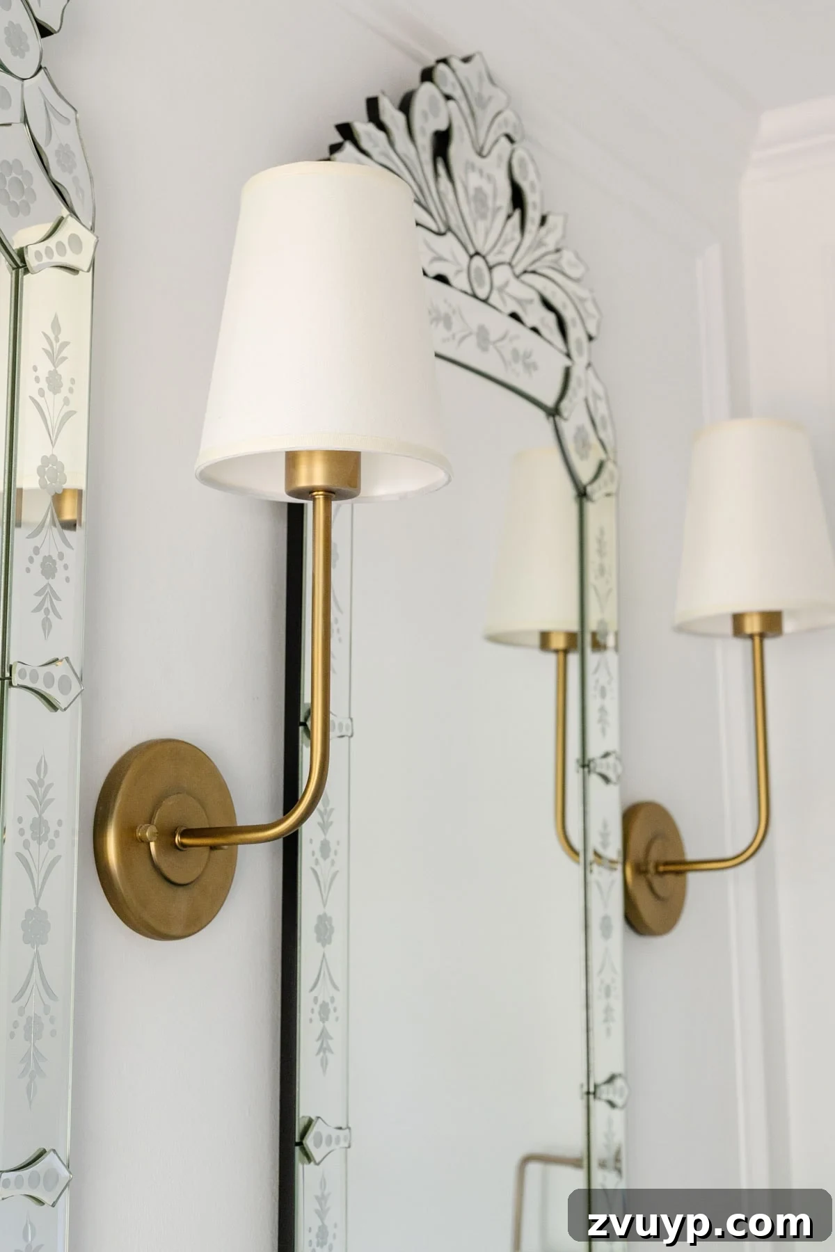 Small Bathroom Illusions: Design Tips for a Spacious Feel 17 Bathroom with layered lighting including sconces on either side of the mirror
